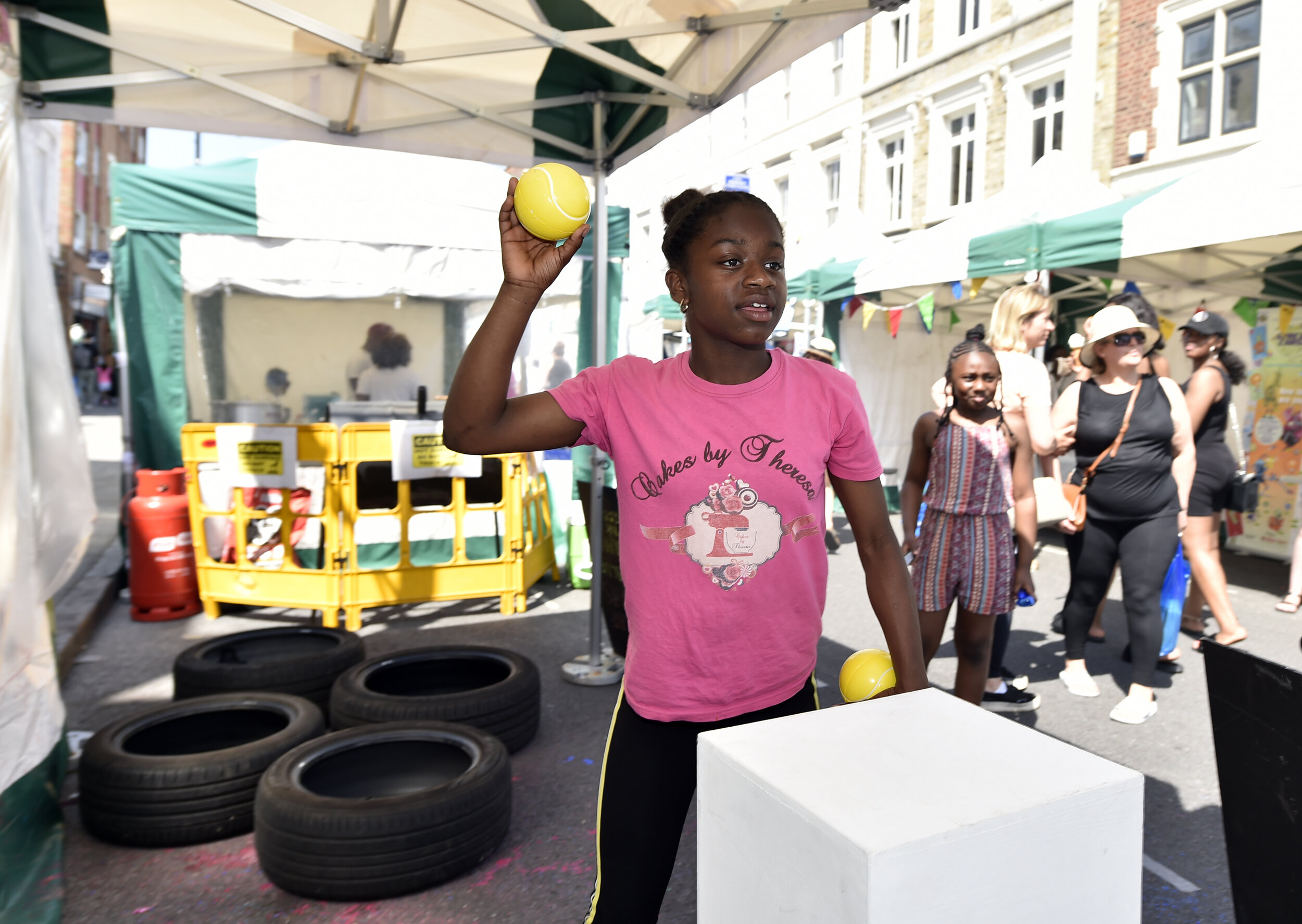 Young people taking part in PEER Ambassador Naile's obstacle course incorporating plinths usually used in an exhibition