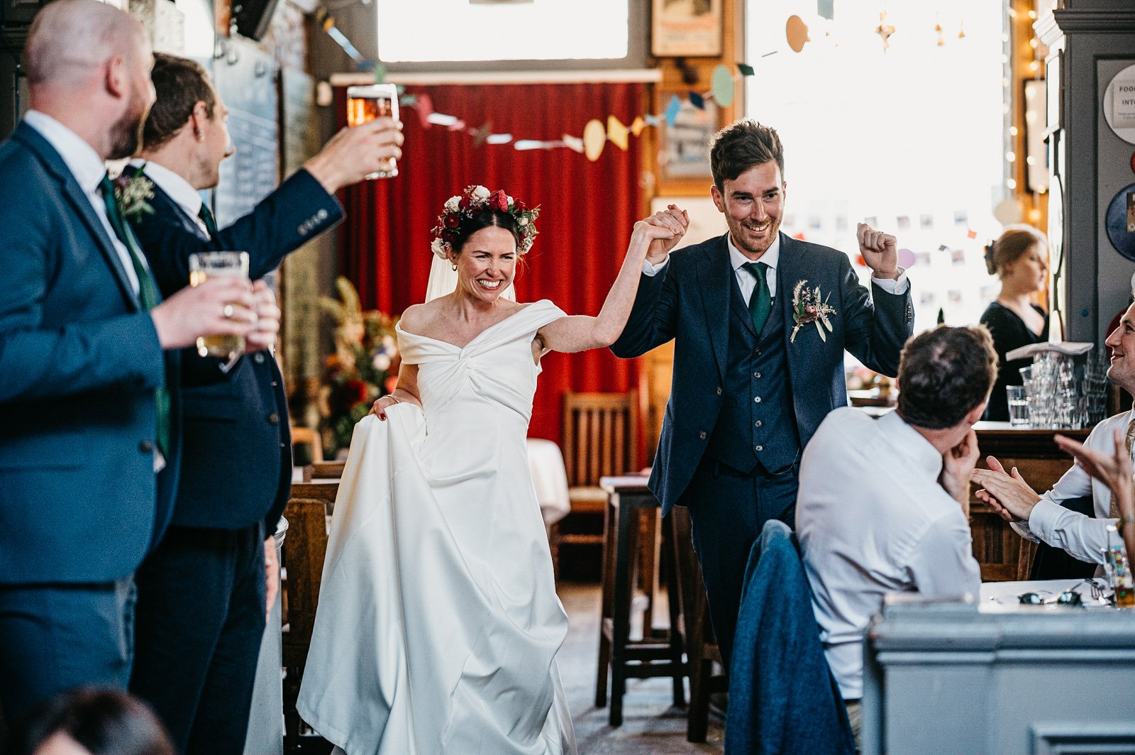 bride and groom entrance to london pub wedding reception