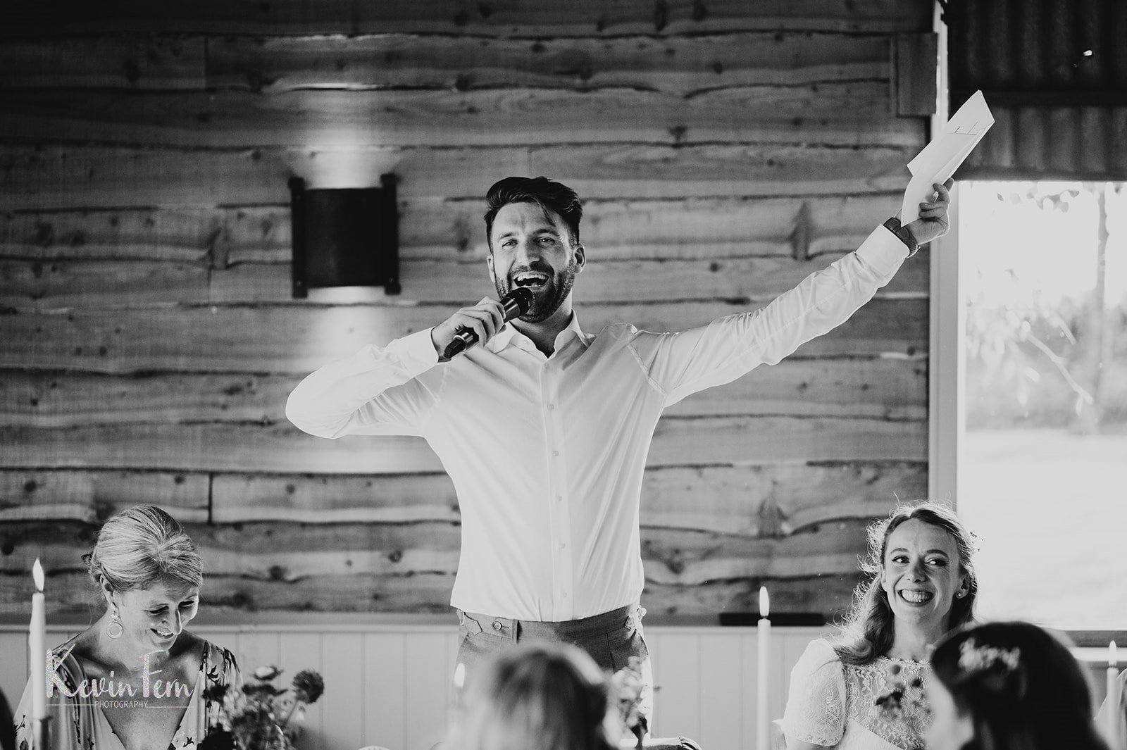 groom makes speech at stone barn in the cotswolds