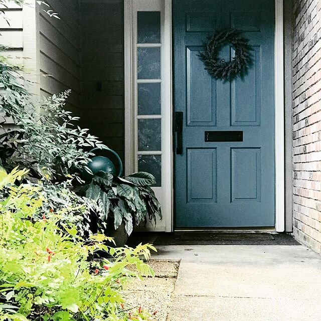A fresh coat of paint by Sherwin Williams, new door hardware by Emtek and a sweet little lavender wreath say HELLO Spring! Is there one small project you could tackle this weekend to freshen up your entry? #designaspaceforyourlife #lisabourquedesign 