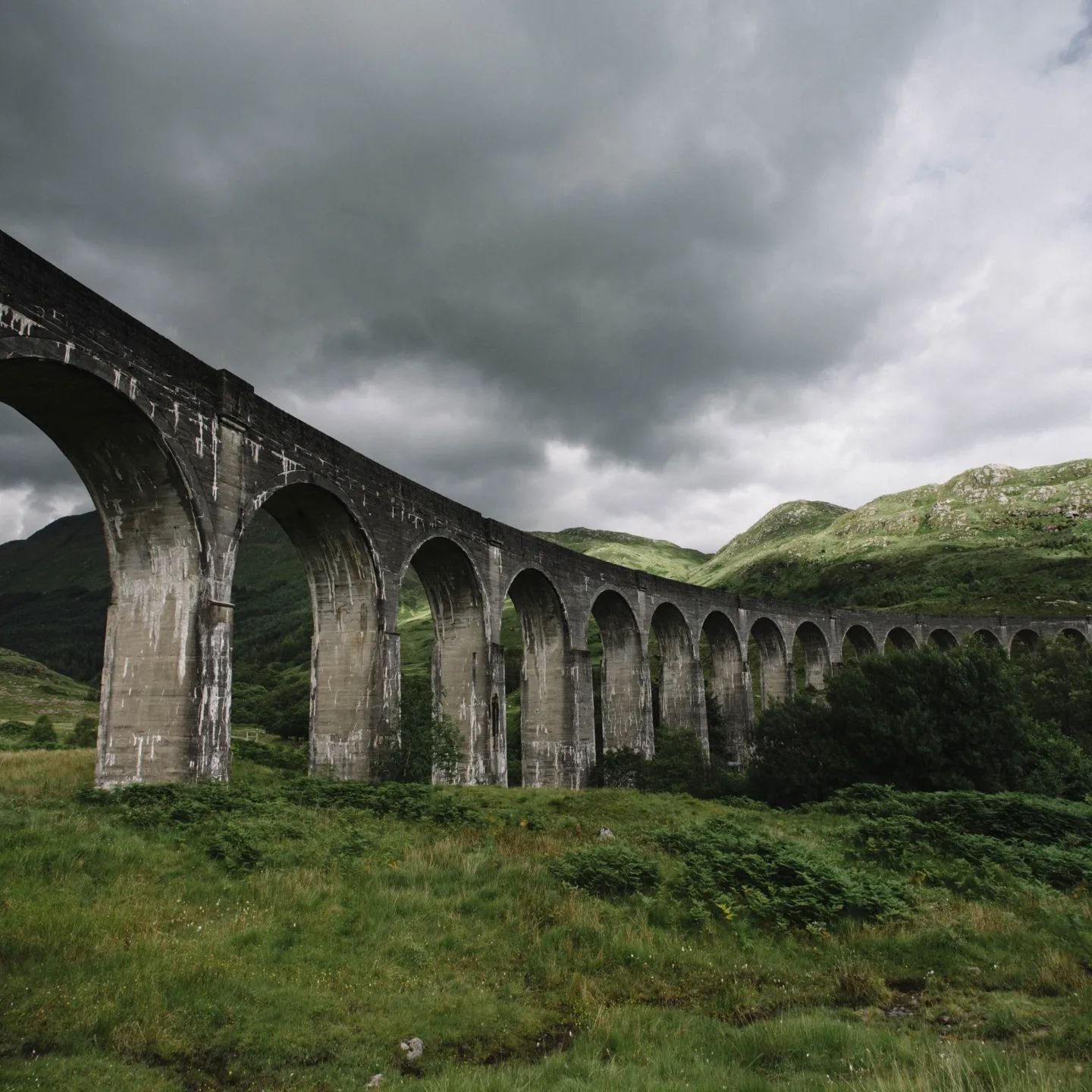 Beautiful Glenfinnan Viaduct on a stormy summer's day. The 'Road to the Isles' covers the area from Fort William to Mallaig and is one of the most beautiful areas in Scotland.&nbsp;

Some tips for this area:

🛥️ Take a day trip to one of the Small I