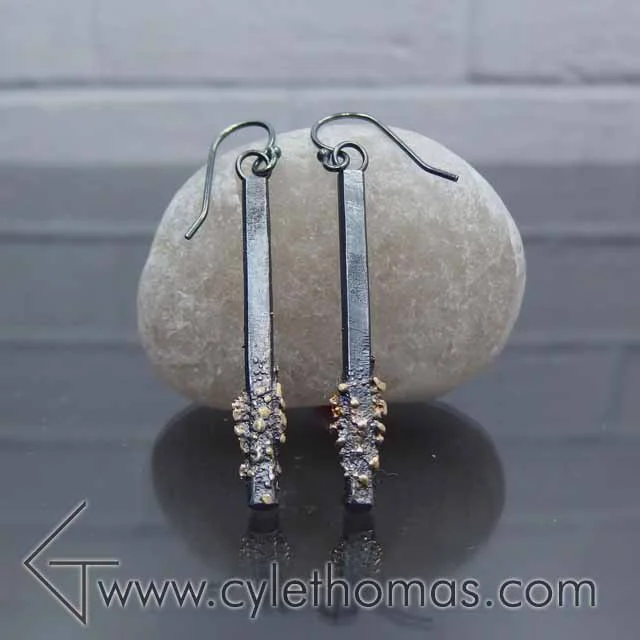  These earrings hail from the Spacescapes collection.&nbsp; The 22K fused gold filings represent stars against the oxidized sterling silver night sky.  Sterling Silver,&nbsp;22K Yellow Gold  Fabricated, Fused, Oxidized 