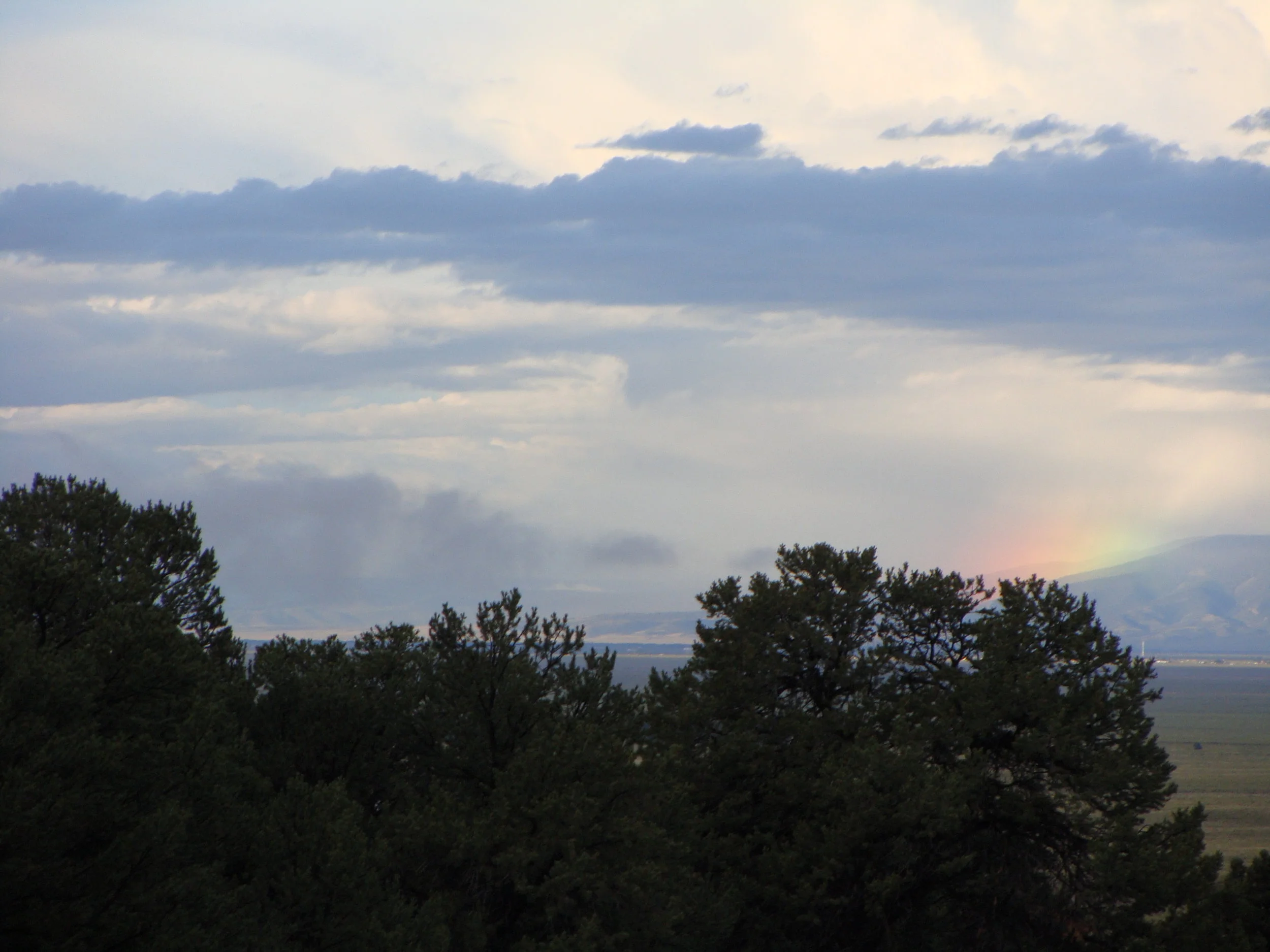 And equally beautiful in the west, a morning rainbow across the valley