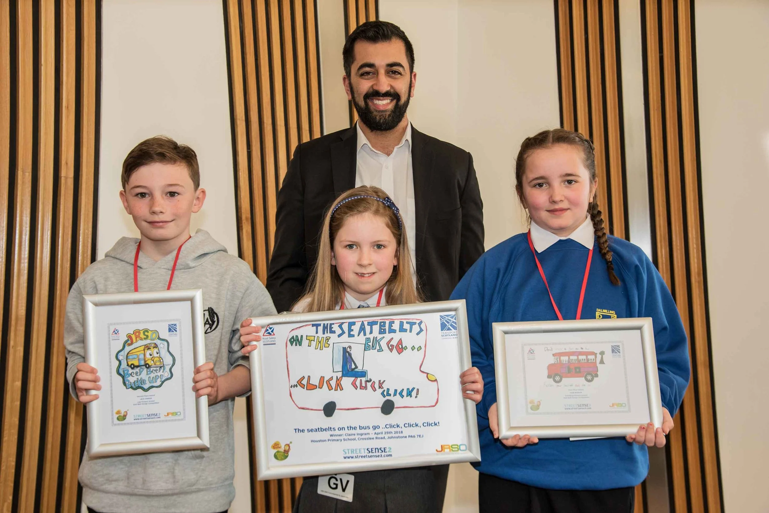 Minister for Transport Humza Yousaf is pictured with the finalists of the Seat Belt Design Competition who are, from left, Jack Parker, who was second, Claire Ingram, who was first, and Dion Benson, who was third. ( click on picture to enlarge)