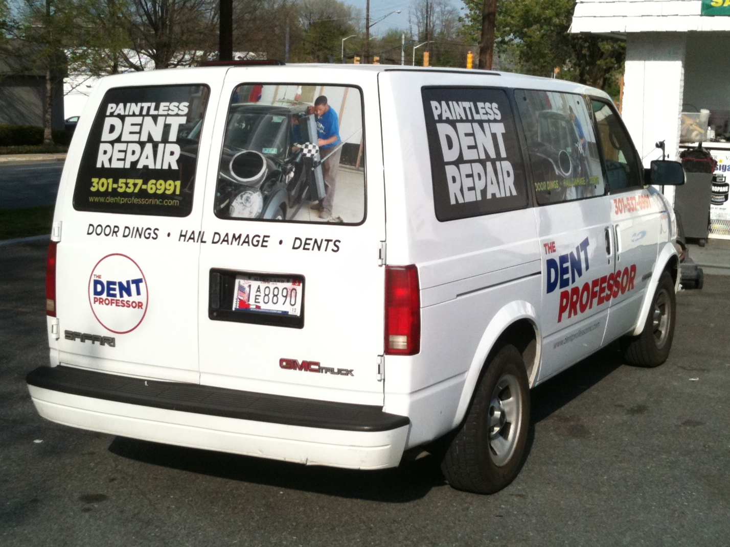 Full color prints on perforated vinyl plus vinyl lettering for vehicle application