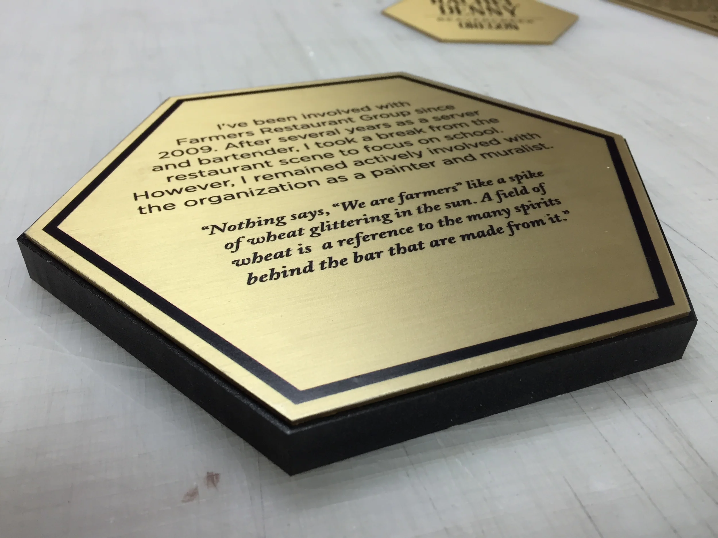 Brushed Brass Artist Plaques for Founding Farmers