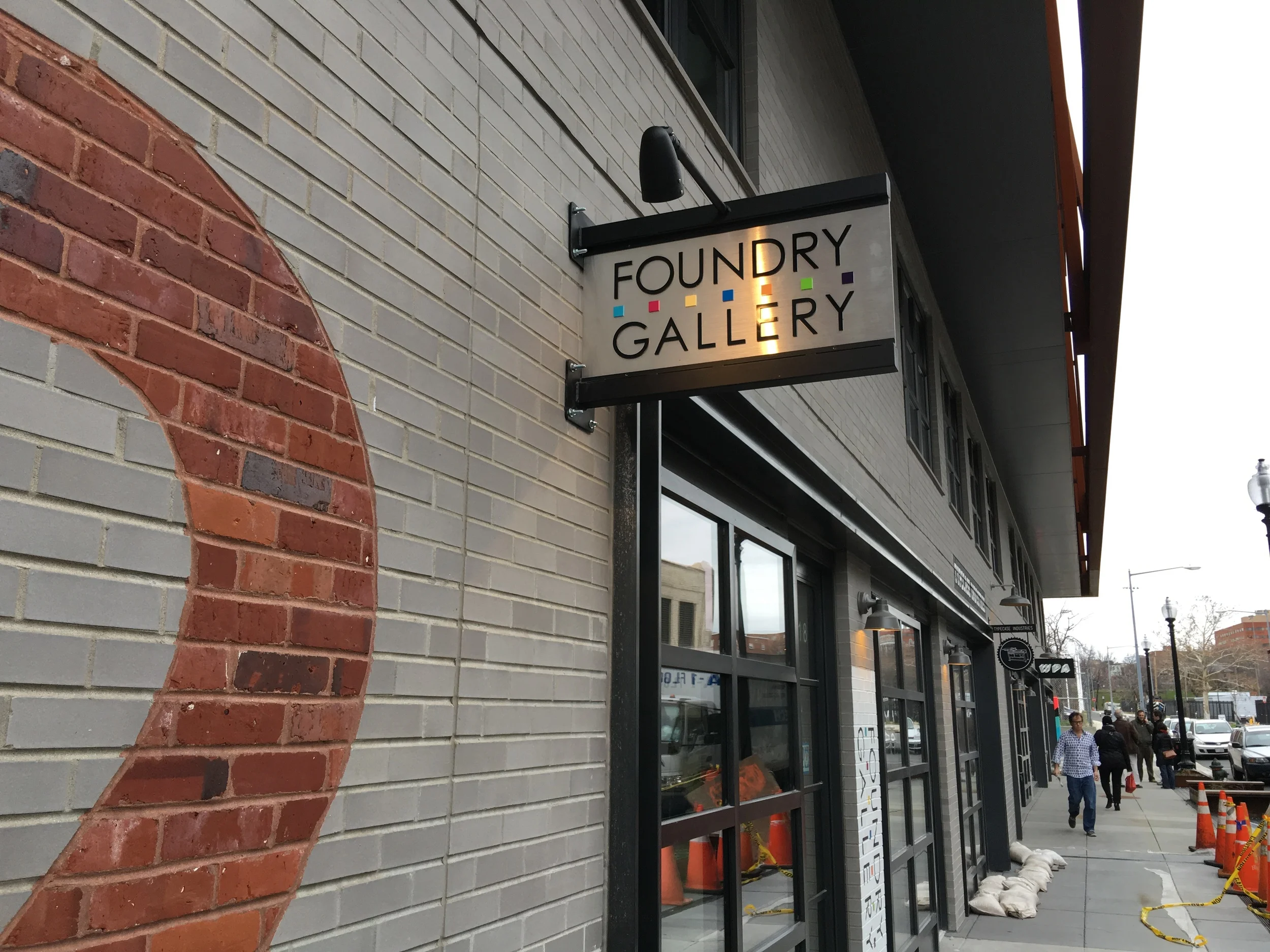 Blade Sign: Brushed metal with painted acrylic letters & lighting