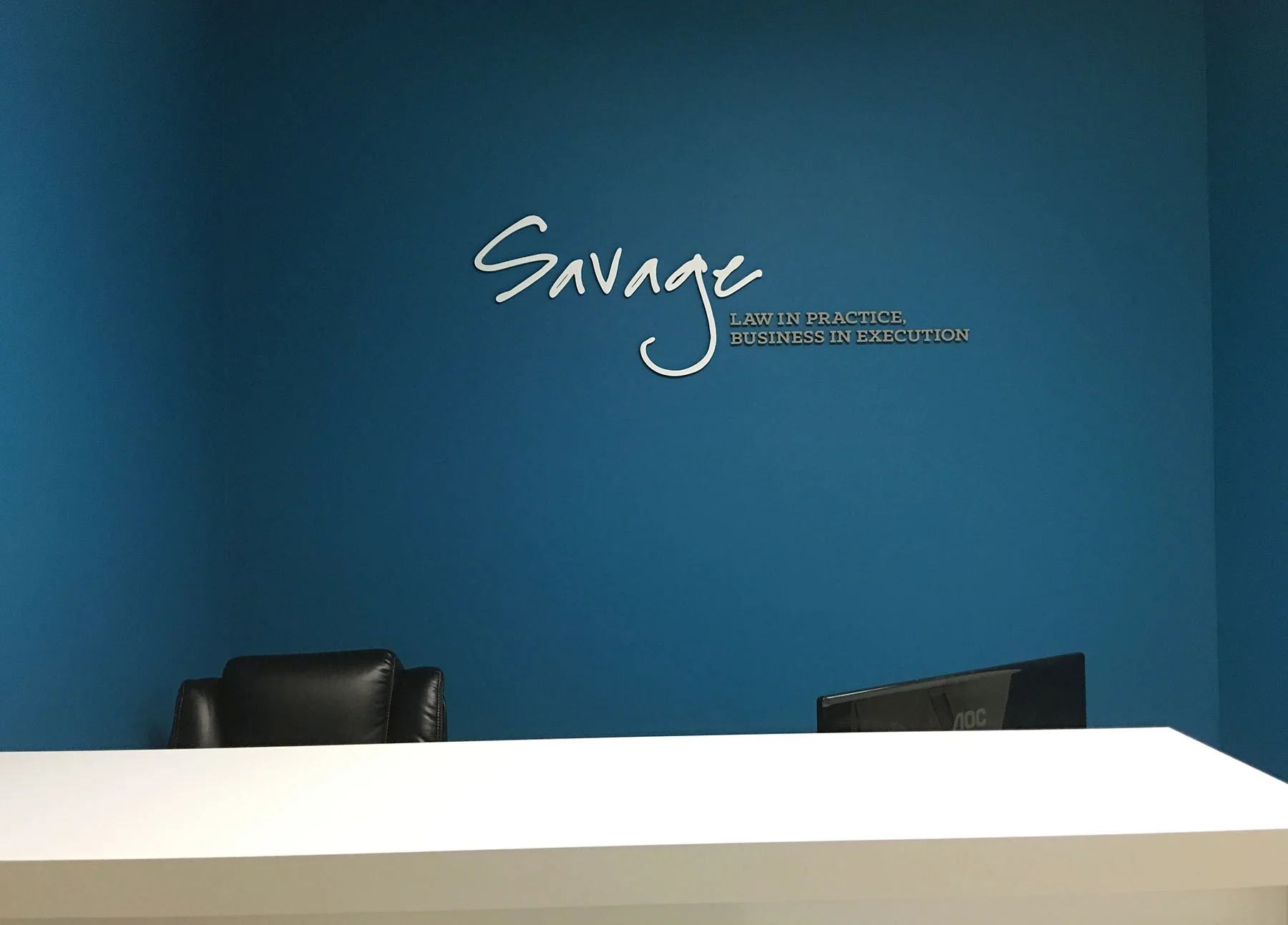 Dimensional Logo: Painted acrylic, mounted to painted drywall