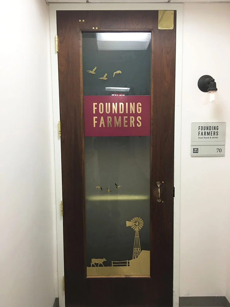 Vinyl: Printed burgundy and "Mirror Gold", applied to both sides of interior glass panel
