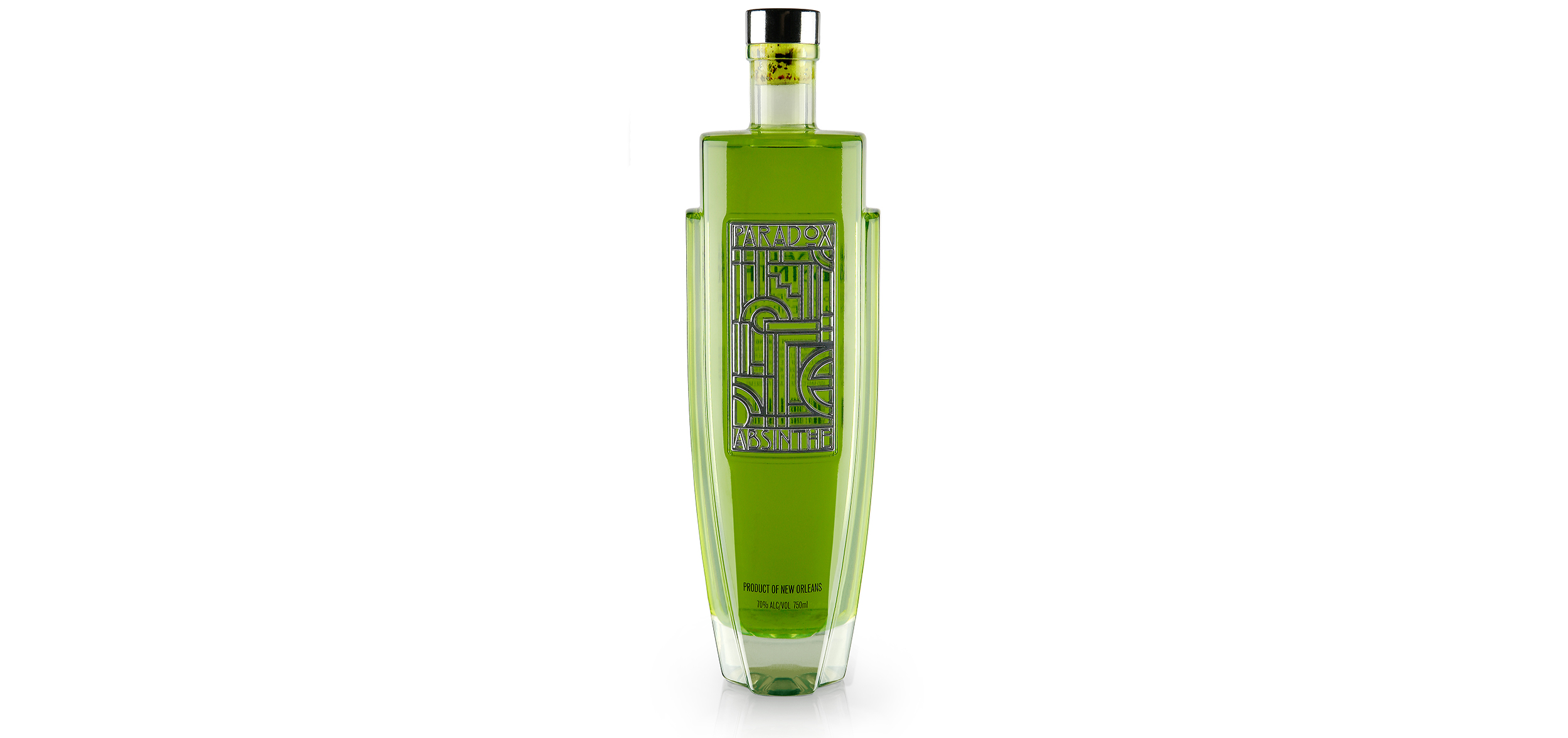 Paradox Absinthe is inspired by the Art Deco Architecture and Speakeasies of the 20s which are expressed both in the overall structure of the bottle as well as in the geometric pattern of the central panel. The graphics are 3D in nature and are embodied by a metalized inlay that brings further textural definition to the holistic form, a beacon of structural and graphic harmonization. The bottle is weighted high to evoke exclusivity and confidence as well as mirror the higher level of awareness and sensory experience often connected with the spirit of Absinthe. The positive and negative space, along with the reflective quality of the chrome inlay, provide a feast for the eyes that gets more decadent with each and every glance.