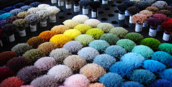 The colors of the poms are the introduction to Distinctive Carpets & Rugs new product line offering various styles of carpeting and area rugs in any color you want and in any width up to 21-feet wide! Larger widths equal less waste and seamless style. 