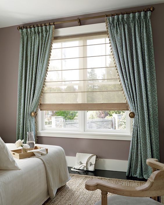 This stunning scene is from Hunter Douglas featuring their Design Studio Roman Shade in Sheer fabric.