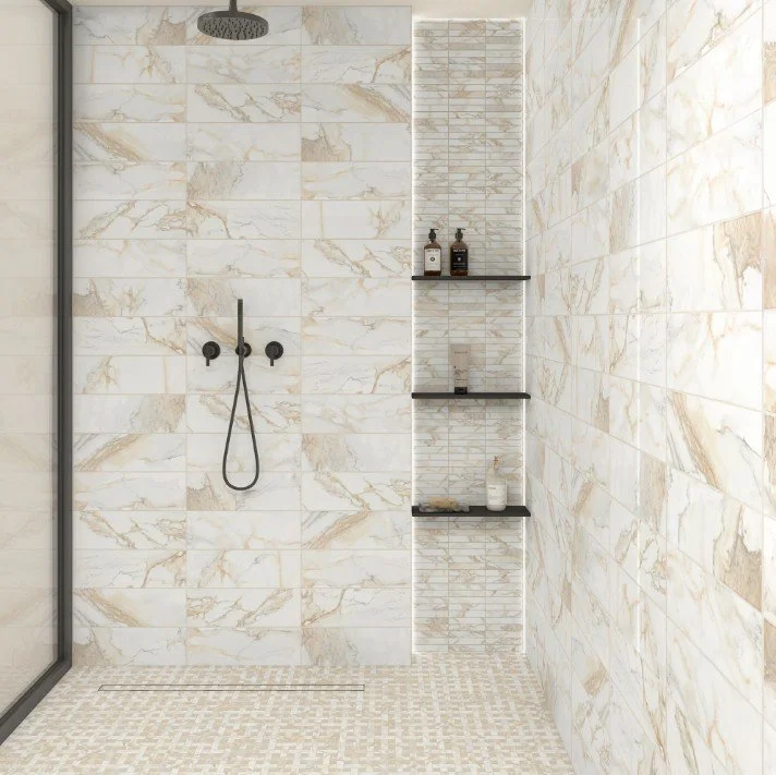 A new year is a good time to experience artistic freedom with tile.
This #TileTuesday, we are loving the selections and layout in this shower.
Can you picture this in your own home?
Express yourself, and start planning a new beginning with our @dalti
