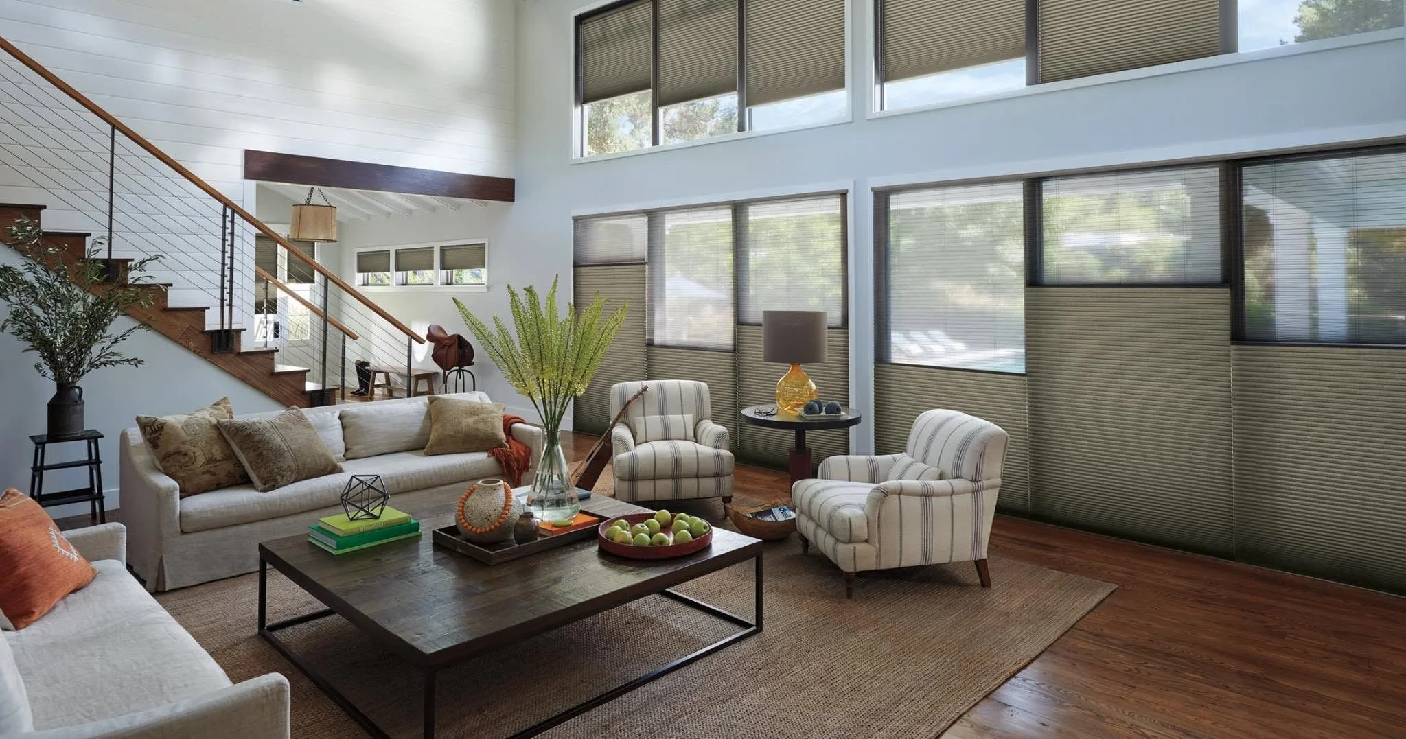 Window covering solution #2,189.
There was a time not so many years ago when hard-to-reach upper windows had only two choices for operation: extra-long cords or extension poles.
Today we don't give those windows a second thought. Today we put a motor