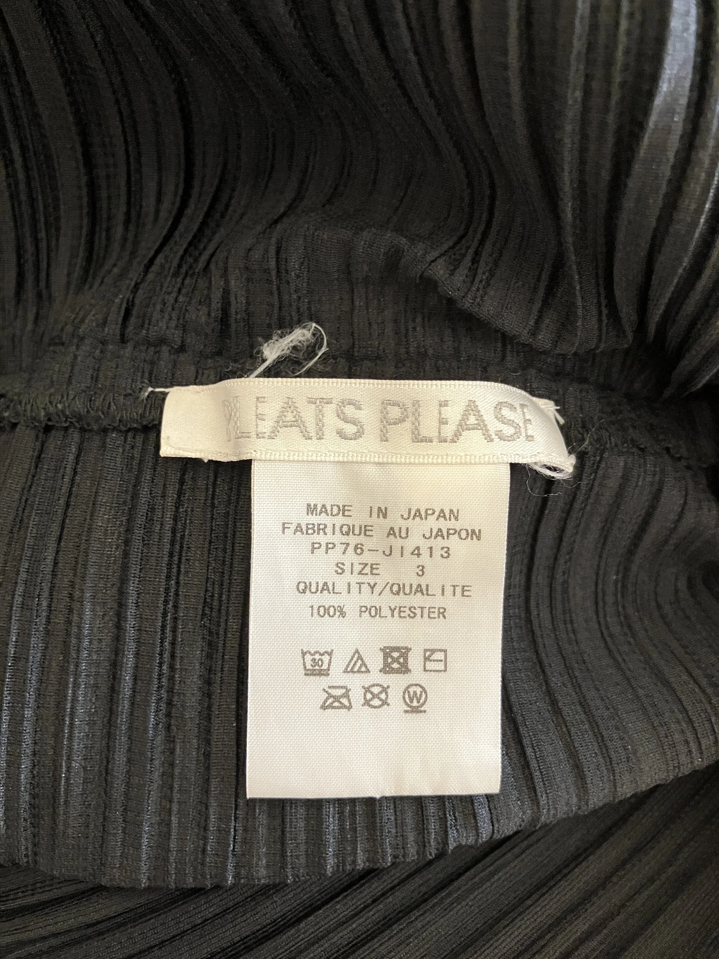 pleats jumpsuit tag.jpeg