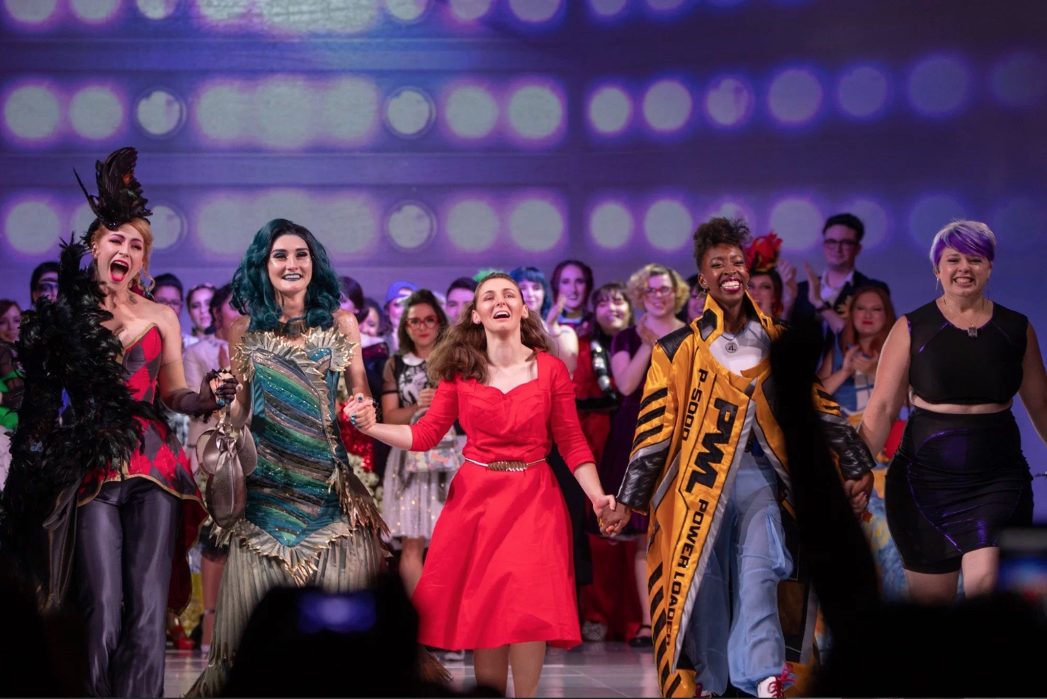 Kristi Siedow-Thompson after winning the Audience Choice award at the 2018 Her Universe Fashion Show. Photo above by Frank Guthrie. Staged Photos below by Mark Edwards. Action shot below by Chrysalis Travel.