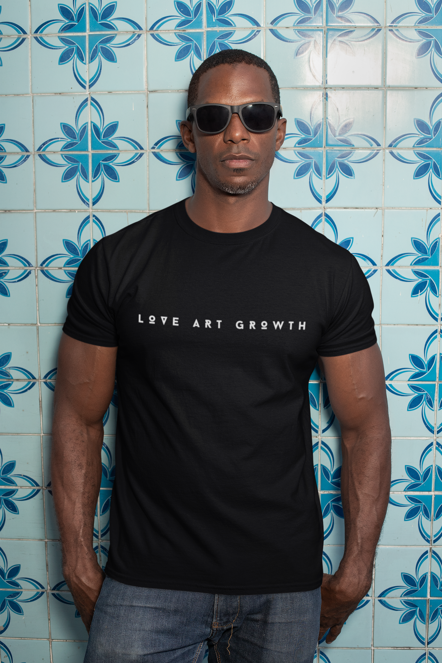 t-shirt-mockup-of-a-man-with-sunglasses-against-a-blue-tiling-30449.png