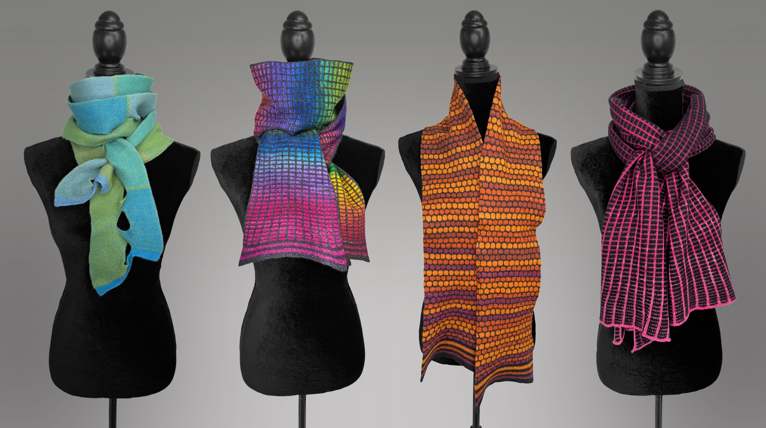 Four mannequins display colorful knit scarves against a neutral gray background.