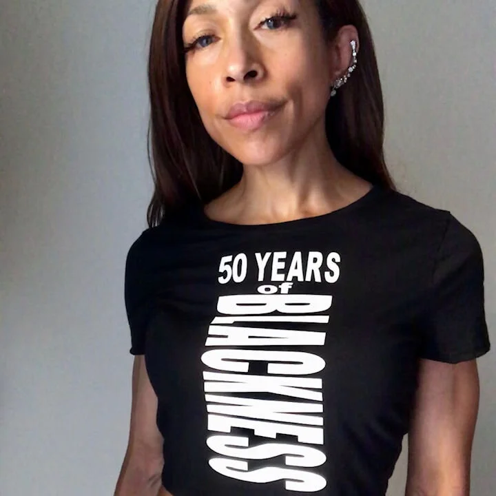 front of 50th Anniversary cropped white letter t-shirt