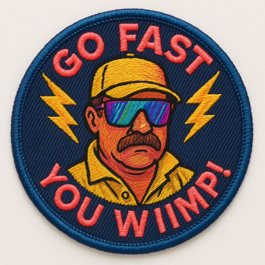 An embroidered patch with a cartoon man wearing sunglasses, a yellow cap, and a yellow shirt. The patch has the text "GO FAST, YOU WIN" with lightning bolts on either side of the man's head.