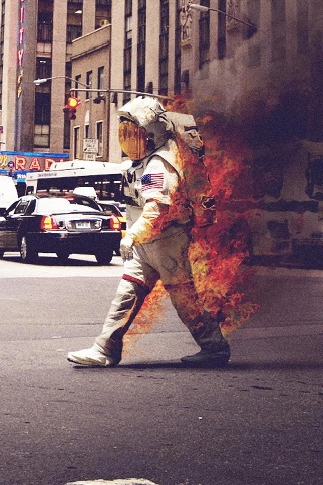 burning_space_man_suit_iphone_4s_wallpaper.jpg