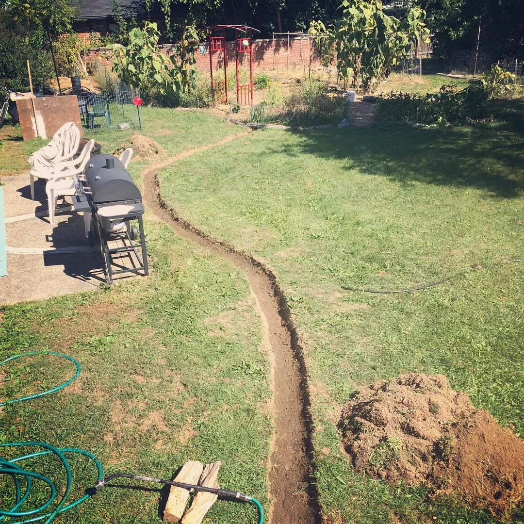 Digging a new rainwater swale to a garden