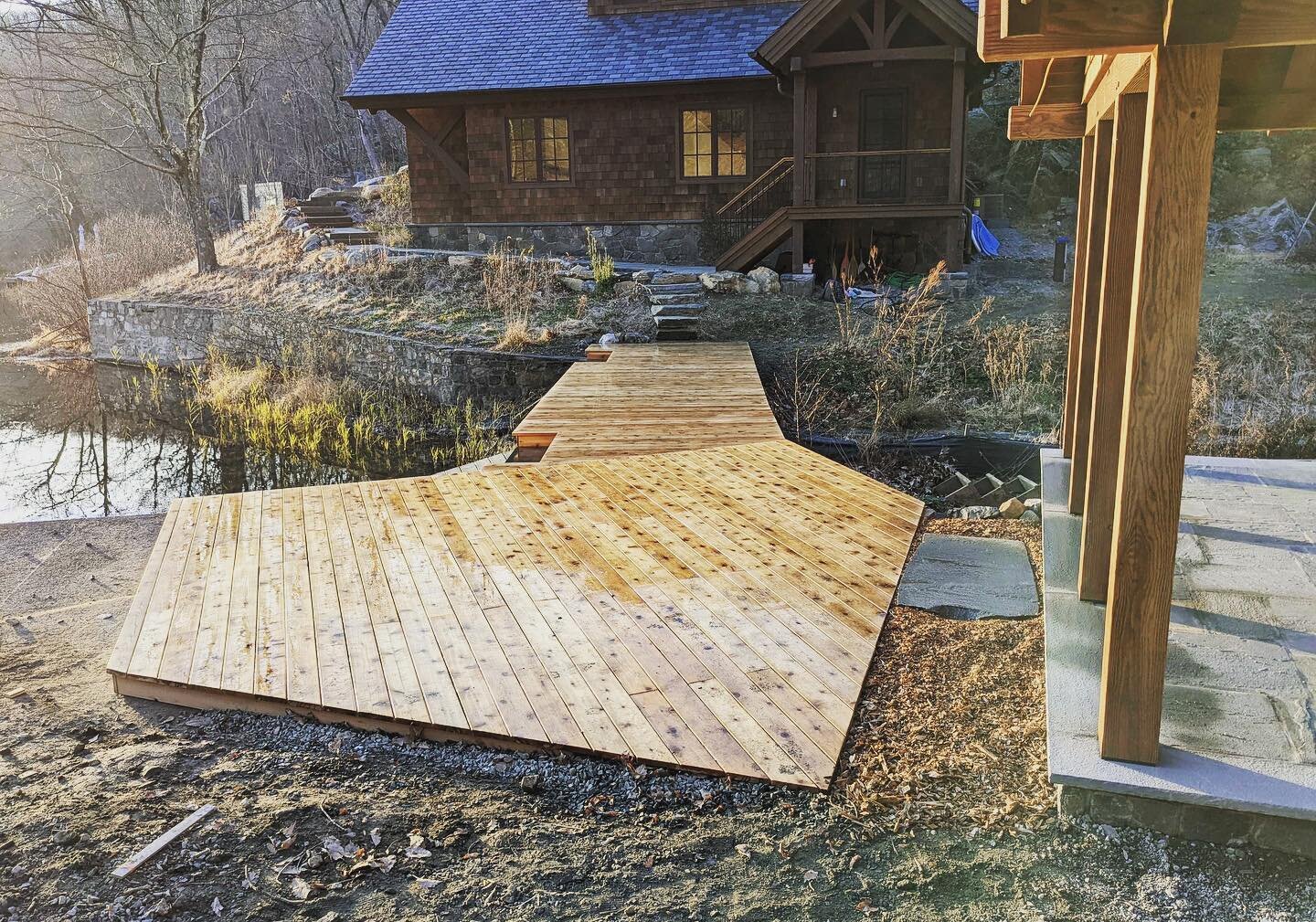 Evening golden light rays celebrated today on this newly built ground level deck across an important #geospiritual lake outlet. Another step forward here on this multi-year lakefront meadow garden vision. The deck shape will make much more sense  aft