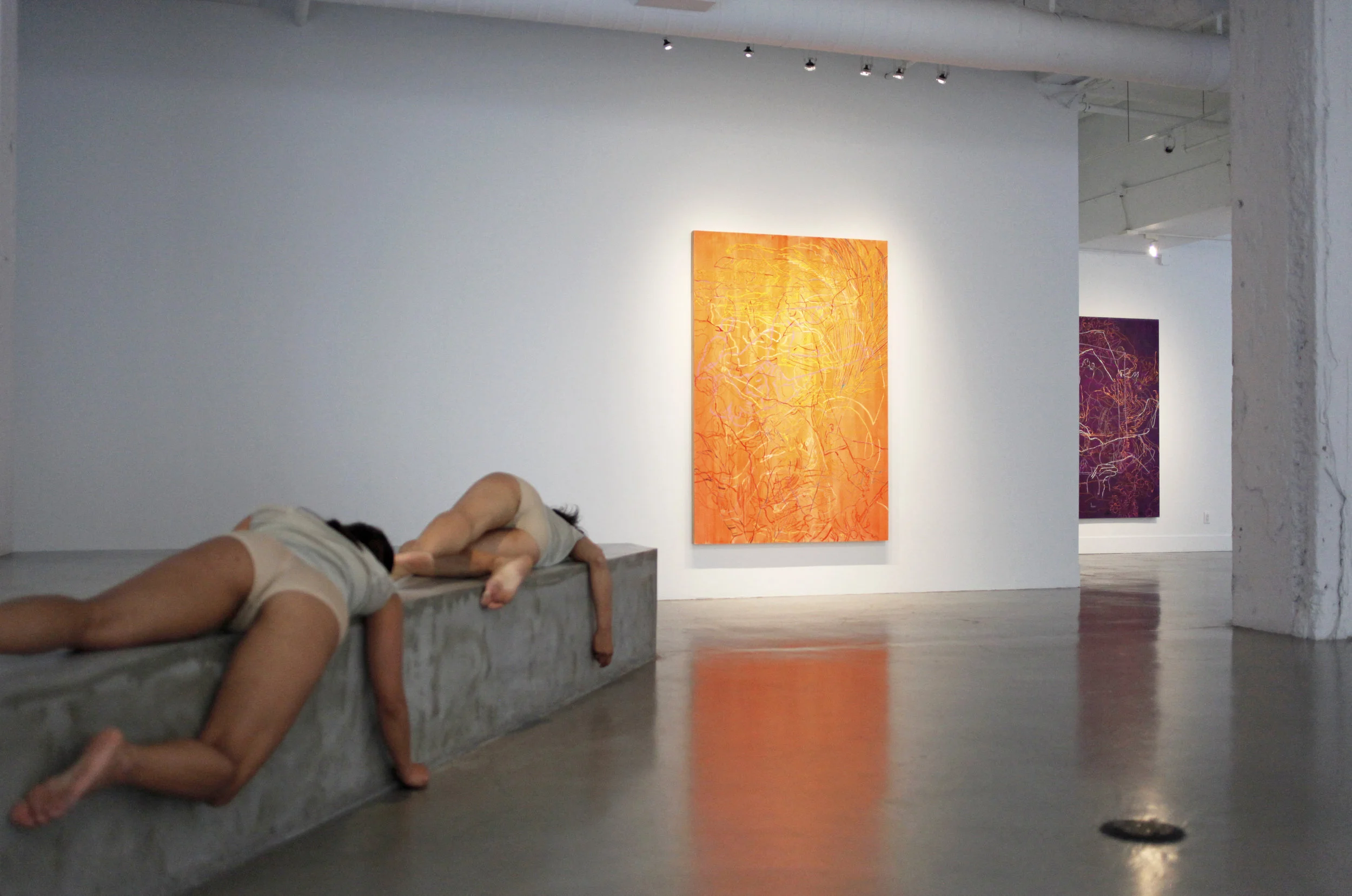 Dancers Karla Quintero and Suzette Sagisi at Gallery Wendi Norris, with paintings by Ranu Mukherjee. Photo courtesy of Danielle Bourassa-Young.