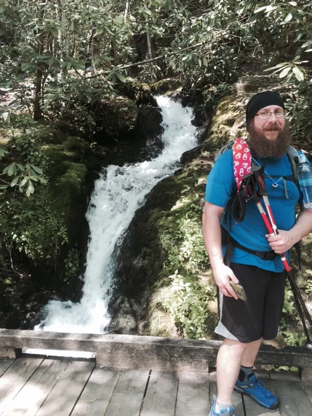 NoKey at a cascade on Little River Trail.