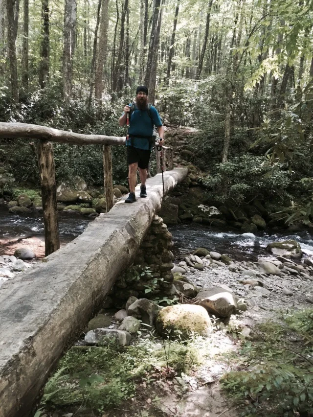 NoKey crossing Deep Creek on a foot bridge