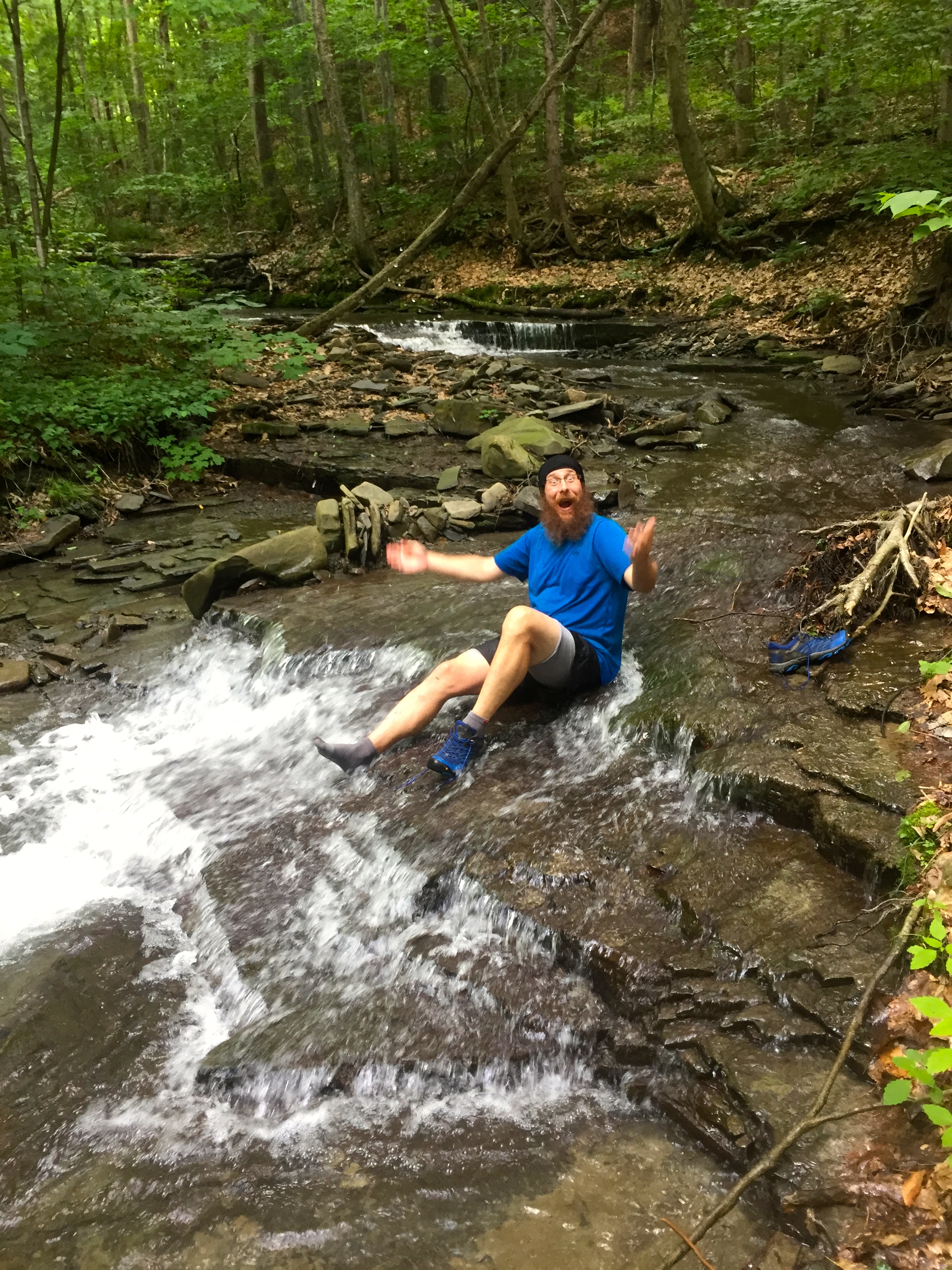 NoKey playing in a creek, washing off the mud and trying to escape the mosquitos!