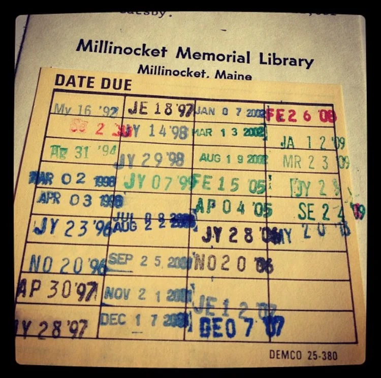 Checking out a book in the Millinocket Library - a blast from the past with the old school card system. 