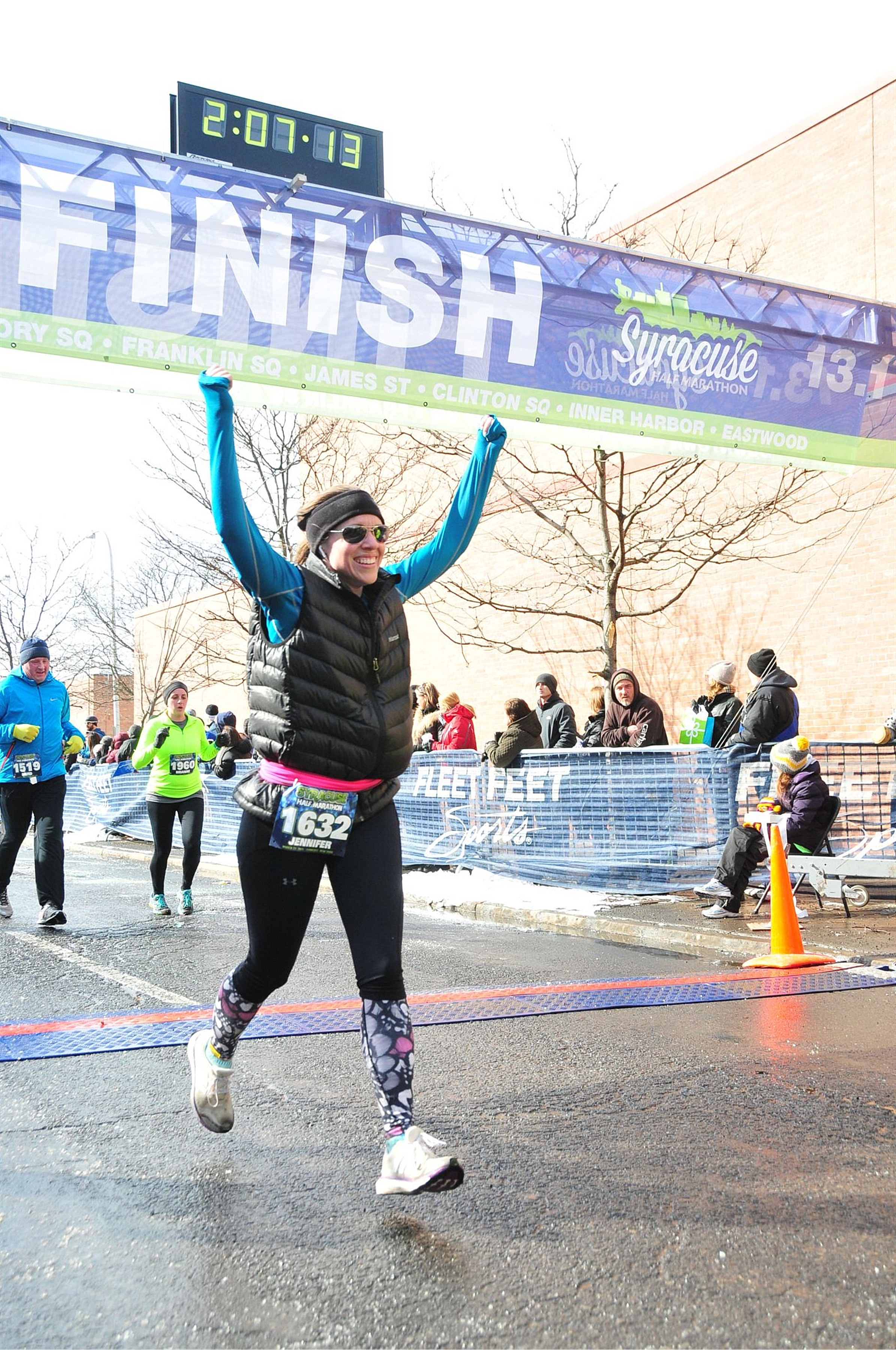 Crossing the finish line of the Syracuse Half Marathon with an official time of 2:05:45 - better than the goal time I trained for!