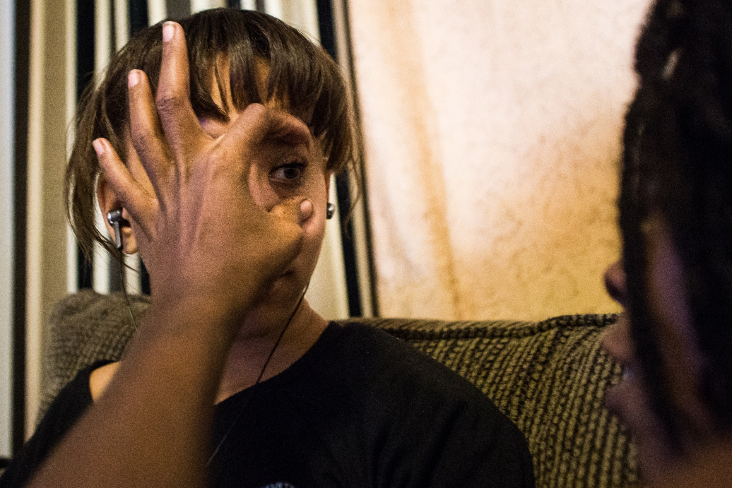  Shana spreads Essence's eyelids open to take a closer look at her iris after reading about the eye in a textbook. "You have really pretty eyes, Essence," Shana said. Shana is currently