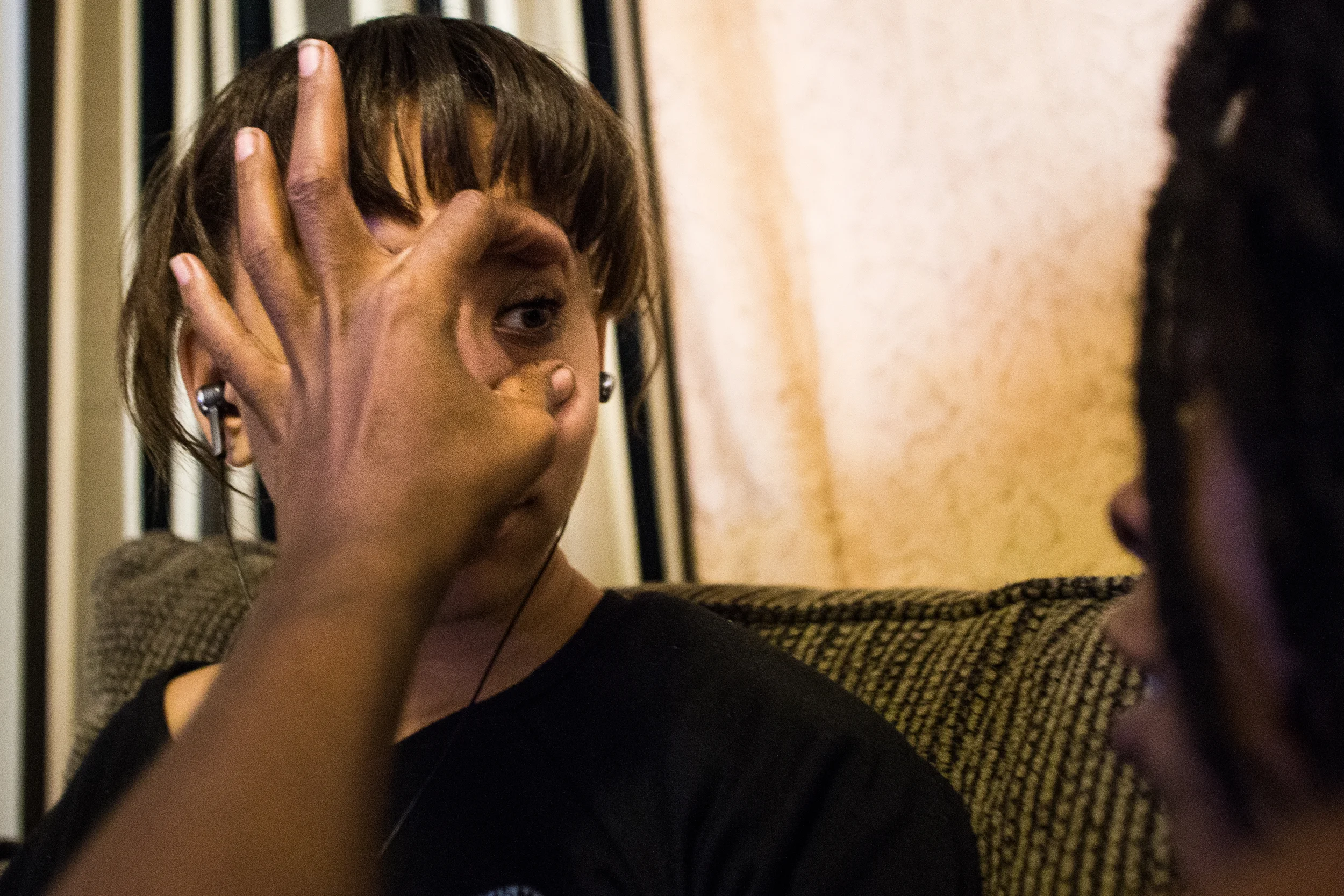  Shana spreads Essence's eyelids open to take a closer look at her iris after reading about the eye in a textbook. "You have really pretty eyes, Essence," Shana said. Shana is currently taking online classes to become a nursing assistant.