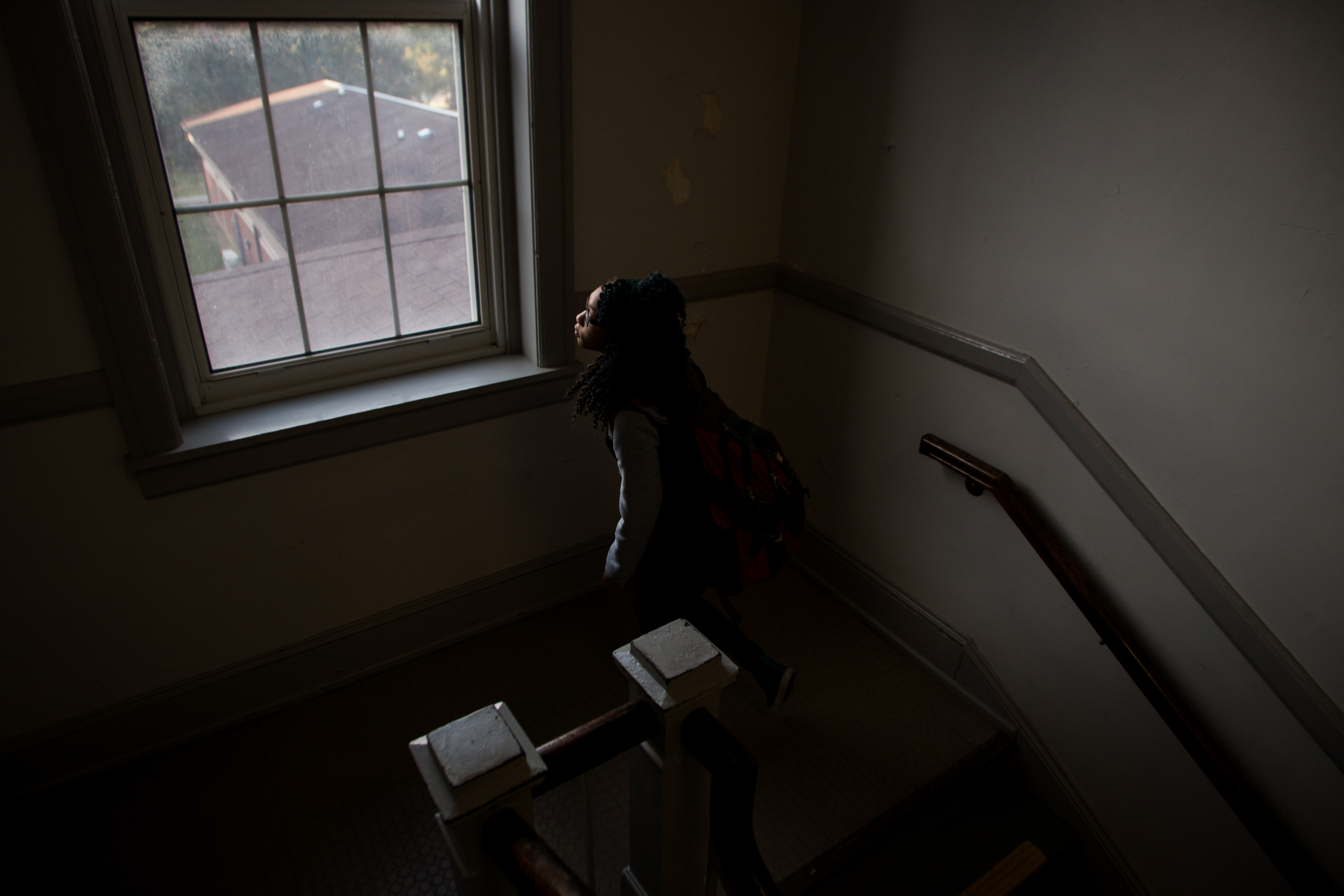  Essence looks out the window as she climbs stairs at GMS. "I want to go to college, which is really hard to get ready for," she said as she thinks about the future. "Hopefully, one day, I'll open up my own little [th