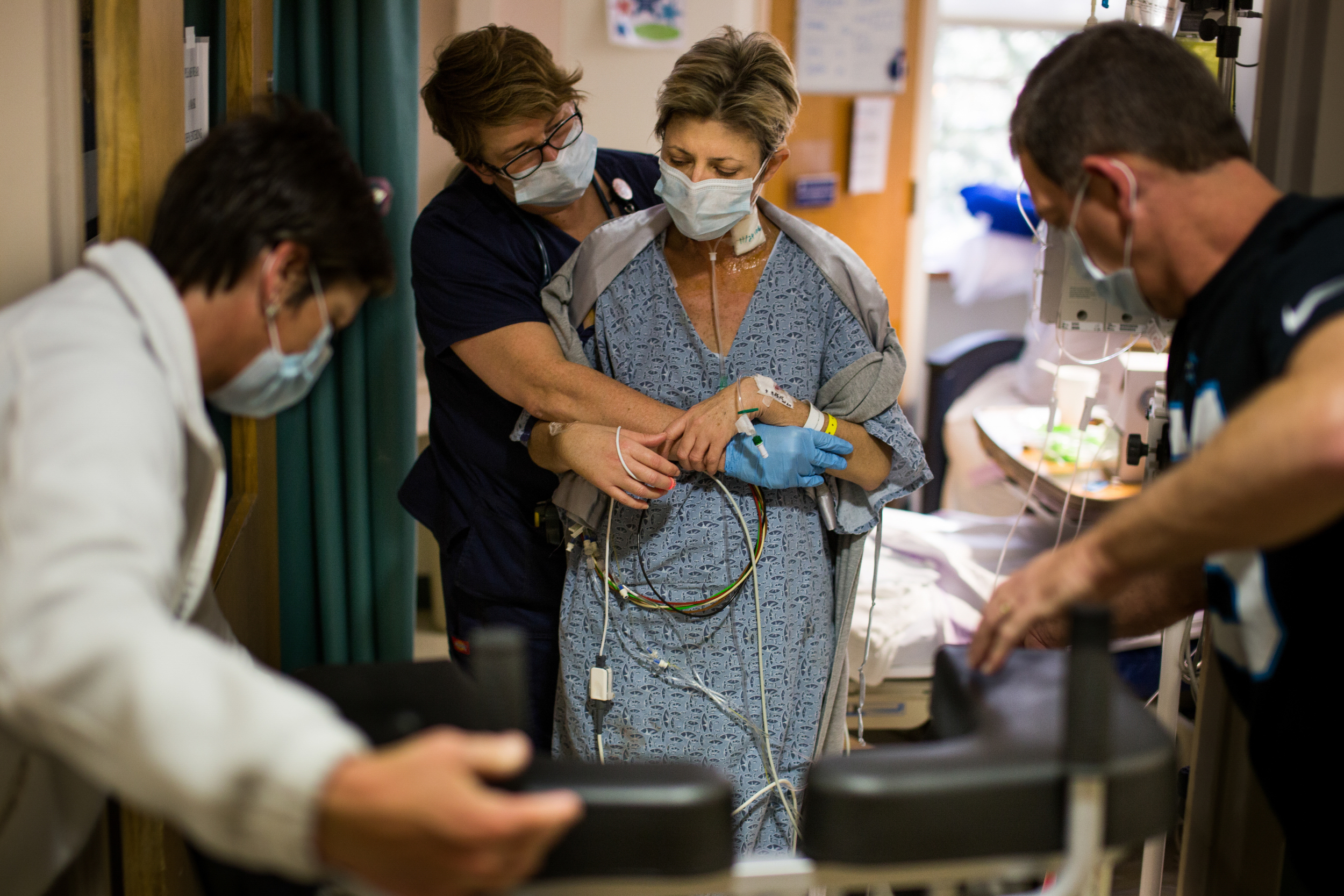 Autum's nurse helps her to the bed after walking two laps with a walker. "I'm not in pain," Autum said. "It's uncomfortable sometimes, but I'm not in pain."