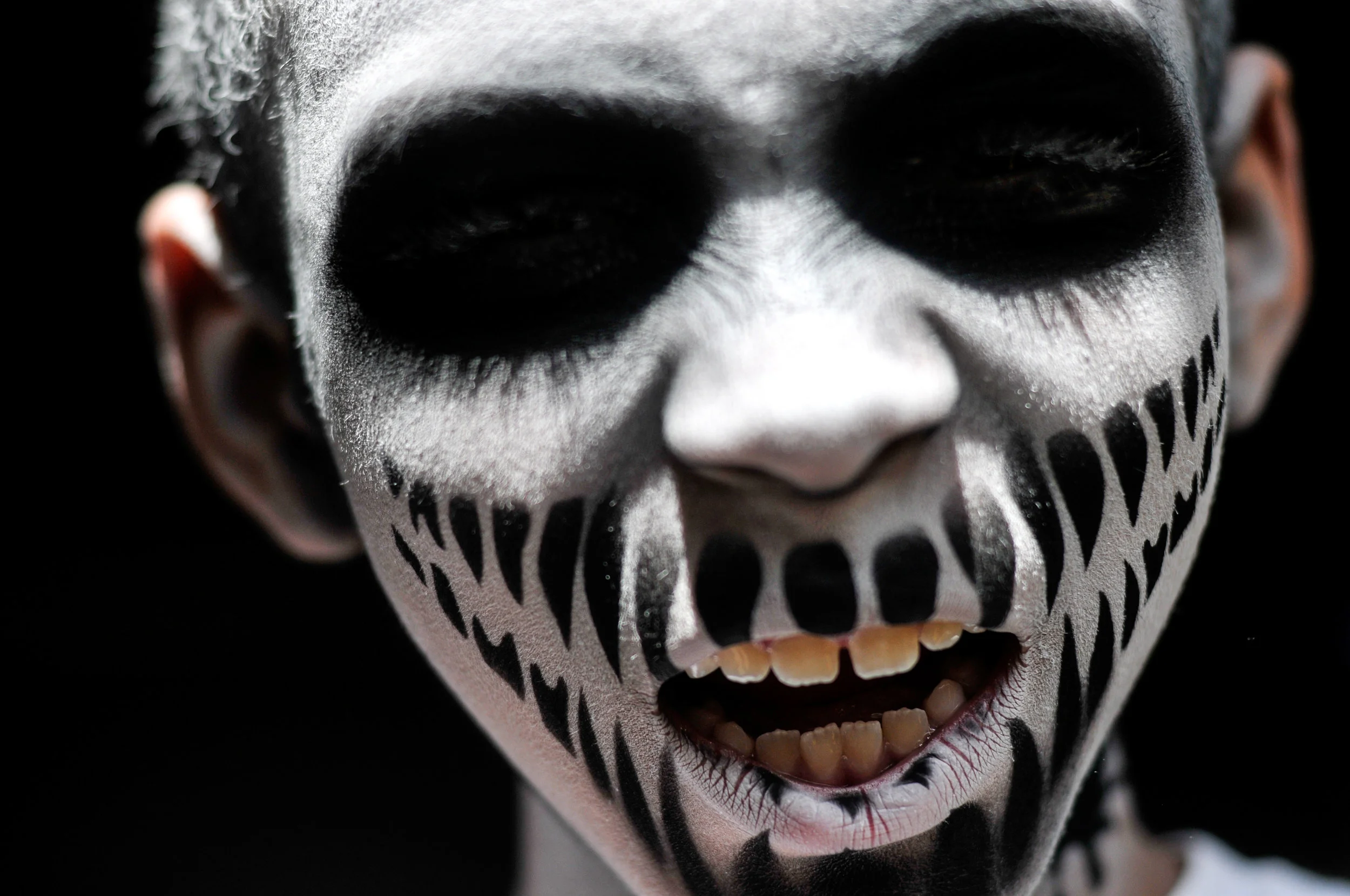 Andre Jones, 8, of Flint, poses with his freshly painted zombie face before the 8th annual Flint Zombie Walk on Saturday, Sept. 24, 2016 at Flint Local 432 in downtown Flint.
