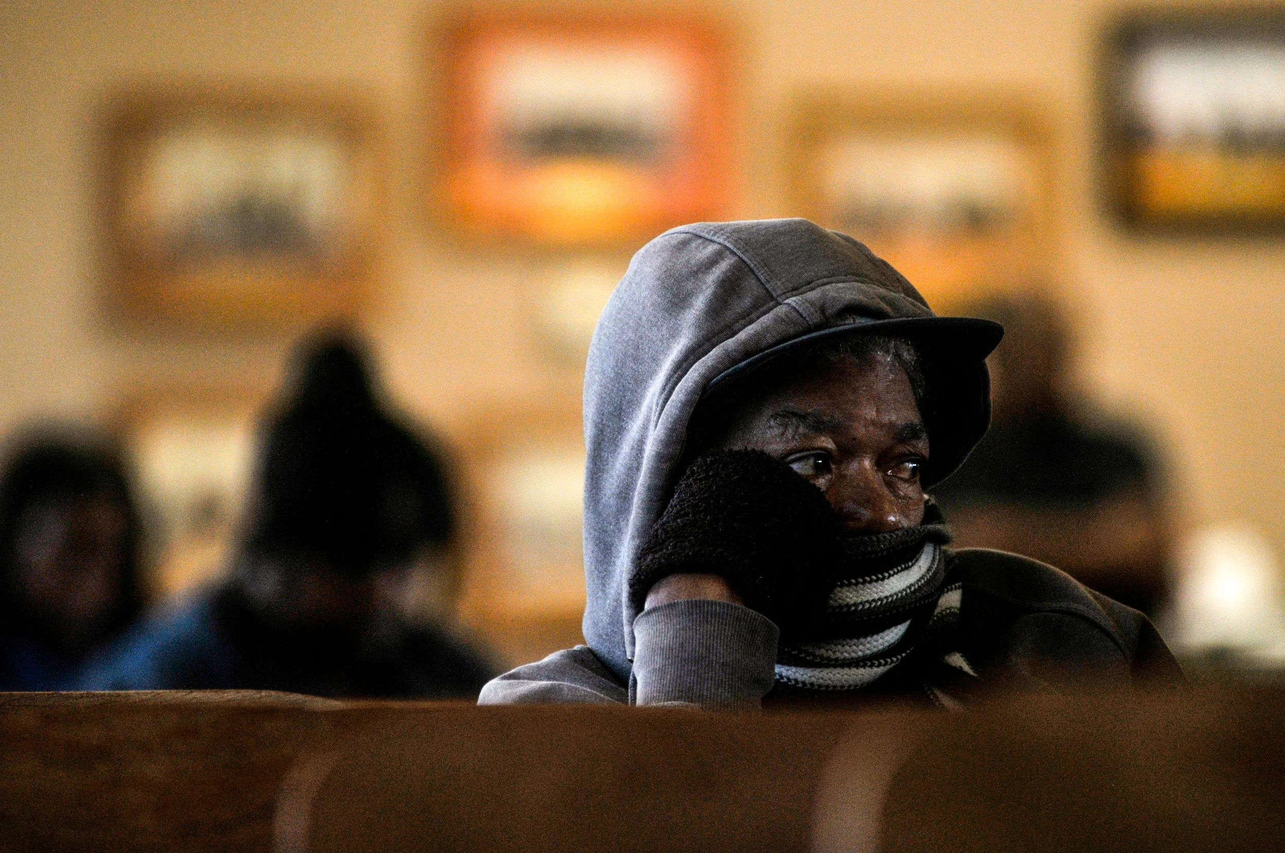 A Flint resident sits and listens to a town council meeting at City Hall on Monday, Sept. 26, 2016 in downtown Flint.