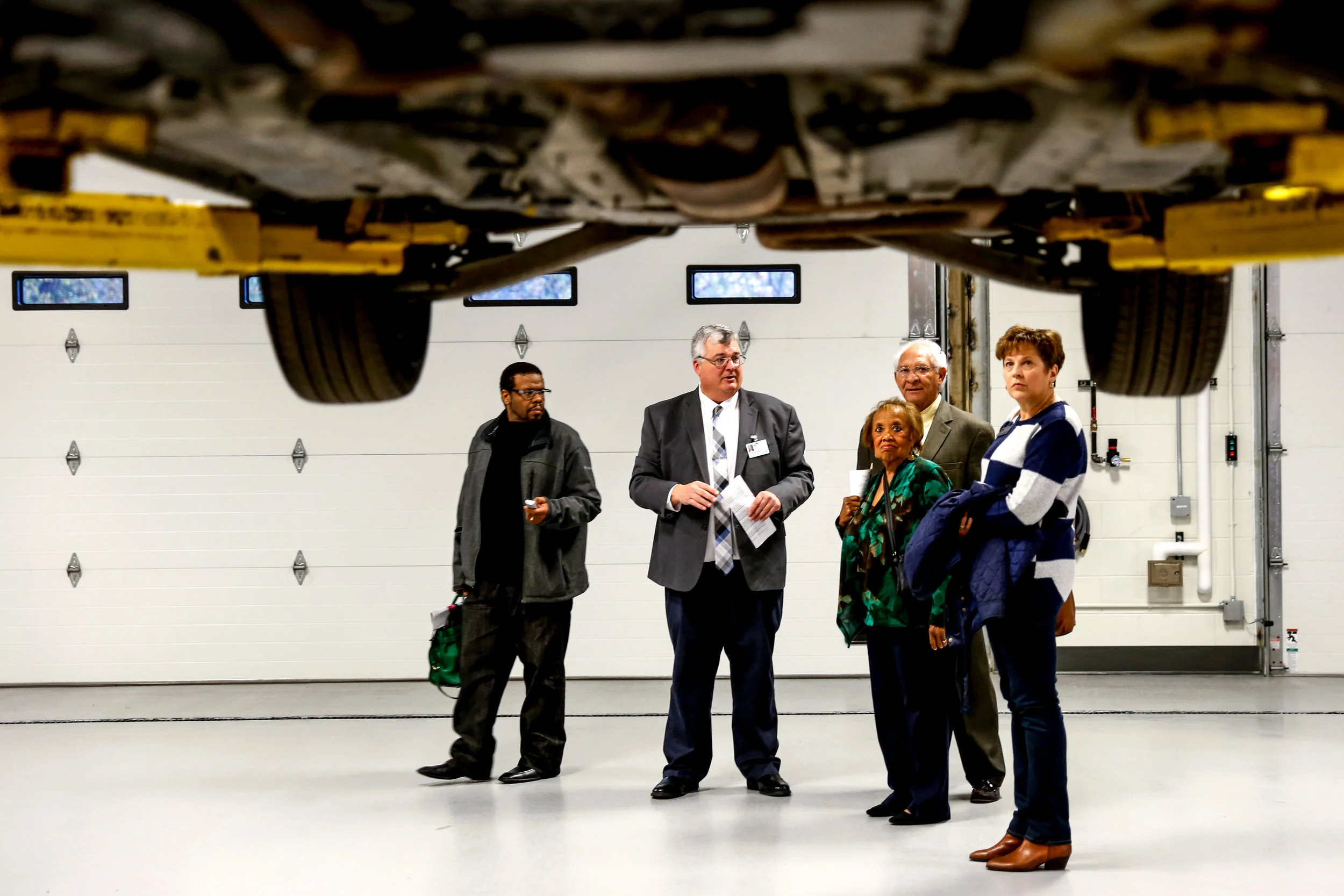 Jim Ply, principal with Genesee Intermediate School District, center, gives a tour of Genesee Career Institute after the ribbon cutting ceremony of a completed construction project at GCI on Wednesday, Oct. 26, 2016 in Mundy Township. The event offered an opportunity for those in attendance to tour the facility and to learn about different programs for students. 