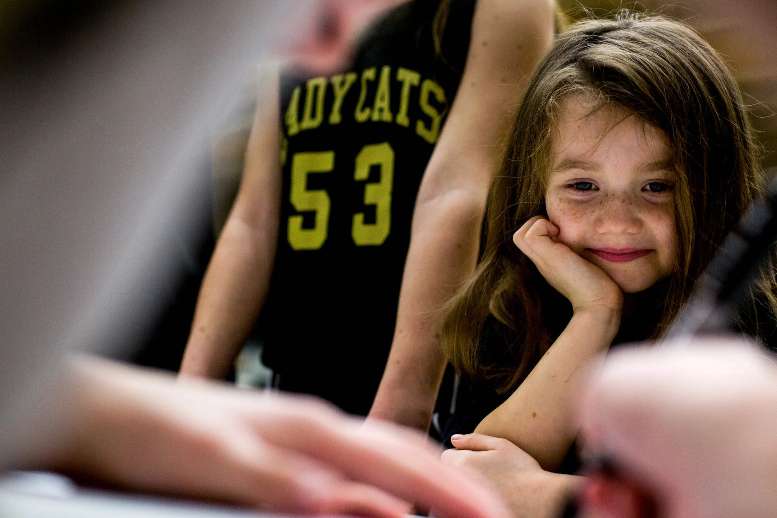 Taylor Underhill of Jasper, 6, watched as Jasper's Brooke Nottingham signed a girls basketball team poster for her after Saturday afternoon's basketball game at Jasper High School in Jasper. Jasper beat Mt. Vernon 62-25.
