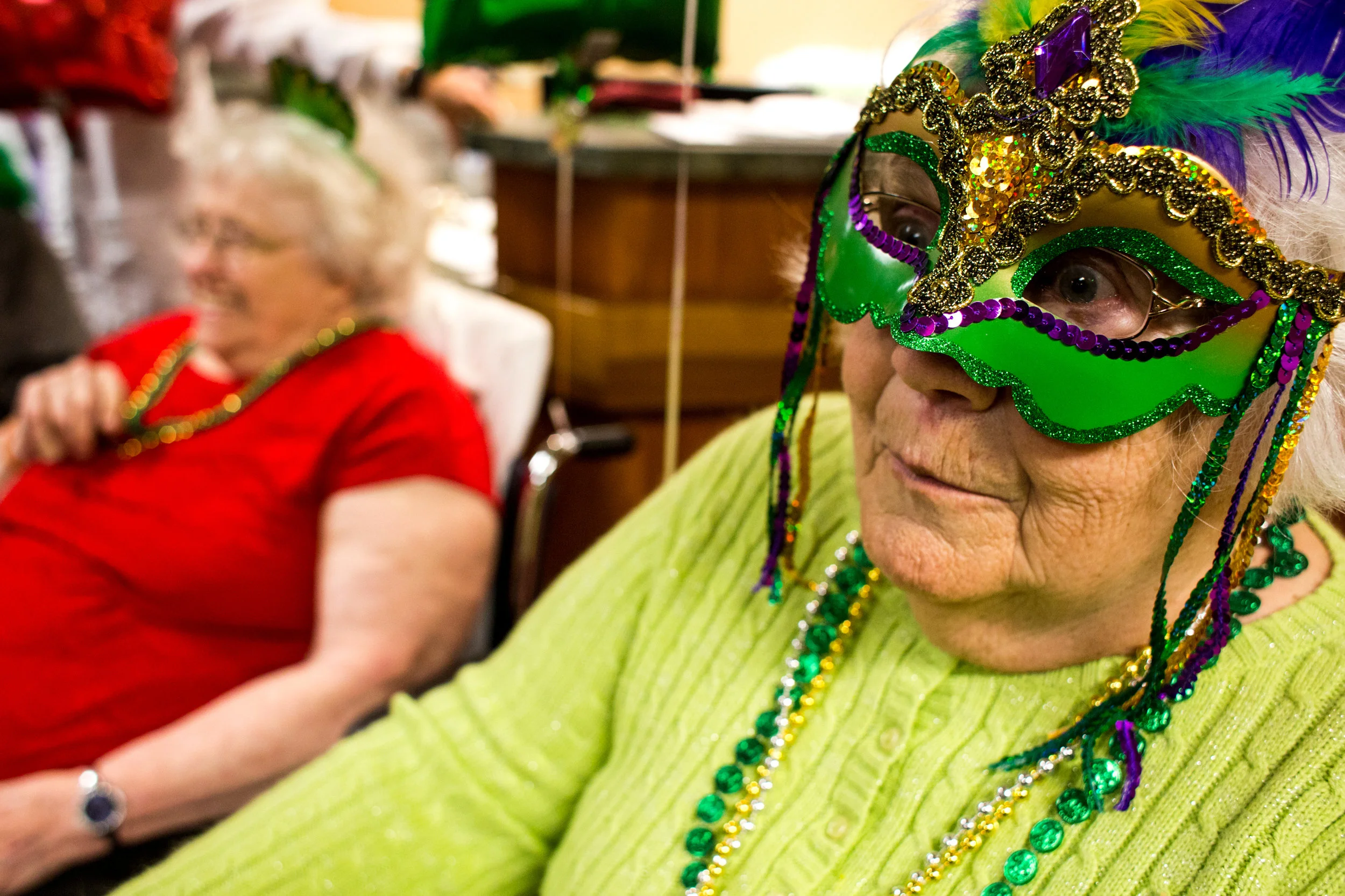 St. Charles Health Campus resident Martha Howard answered trivia questions during a Mardi Gras celebration on Tuesday afternoon. 