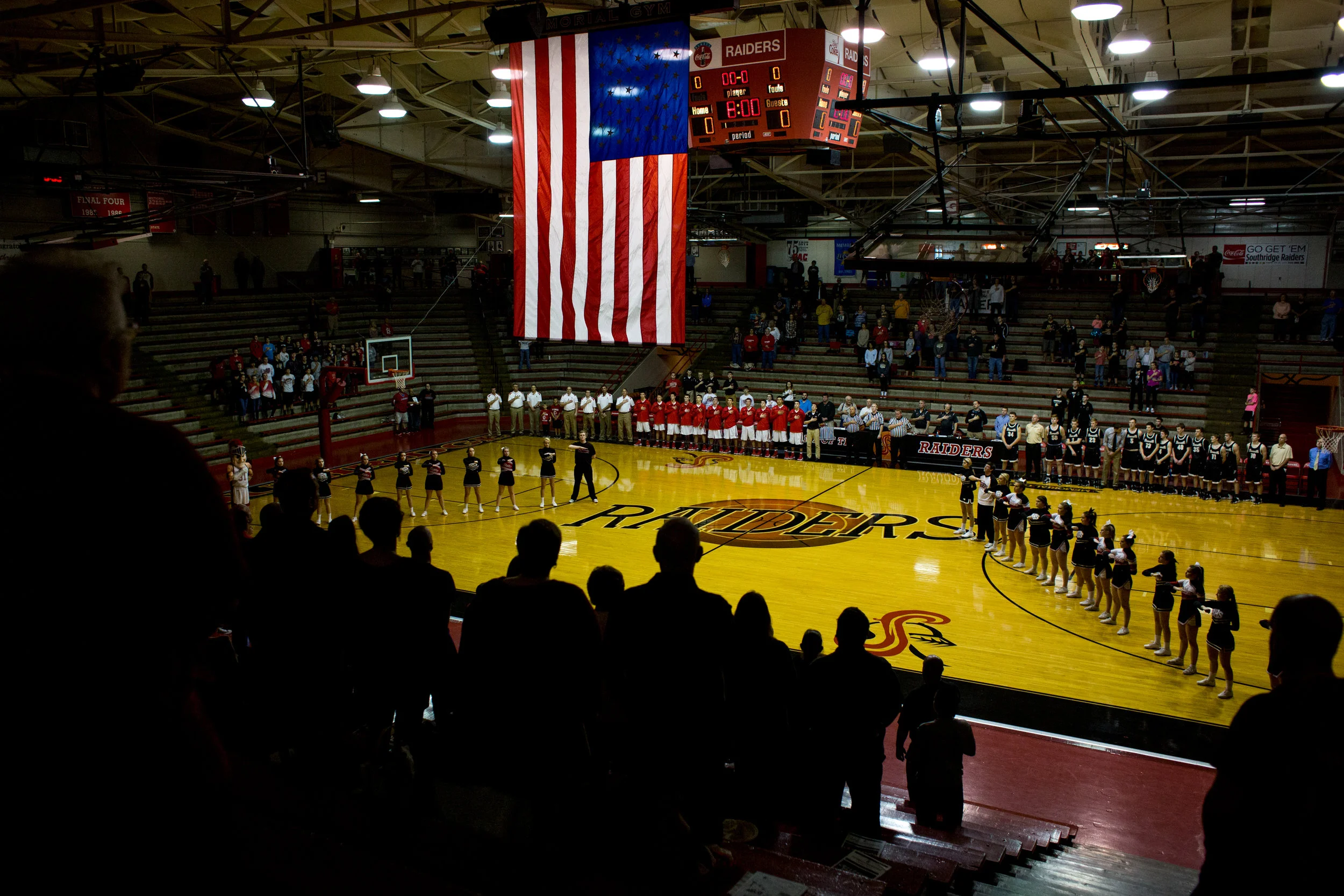 People stood for the playing of the national anthem before Friday night's game against Boonville at Memorial Gym in Huntingburg. Southridge defeated Boonville 56-54. 