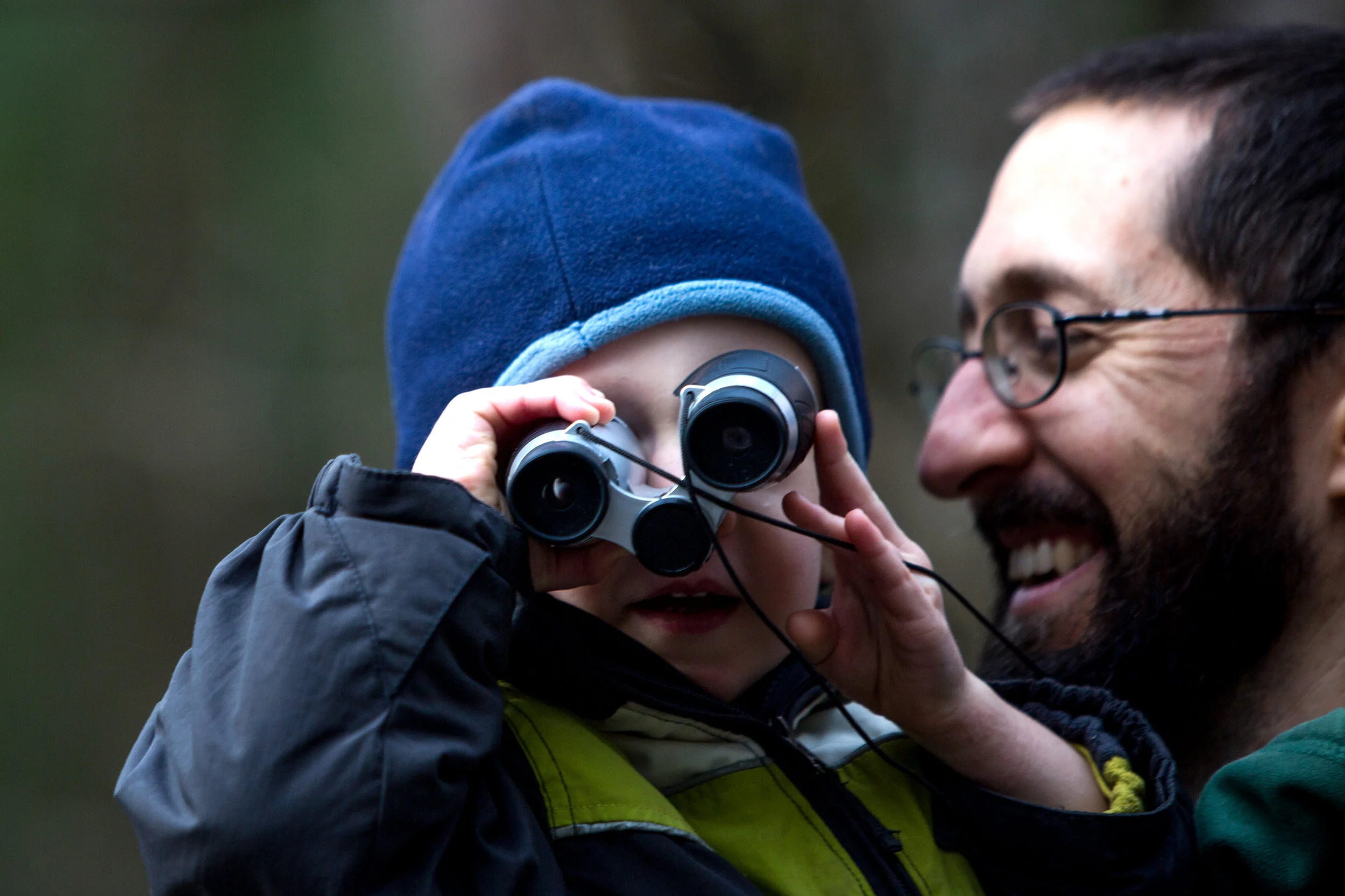 William Schemenauer of Ferdinand, 2, looked through his binoculars while his father, Kevin, carried him during the Cabin Fever Hike on Saturday at Ferdinand State Forest. DC Multisport coordinated the free hikes, and participants were asked to donate a non-perishable food item for the Dubois County Food Bank. The event attracted an estimated 150 people. 