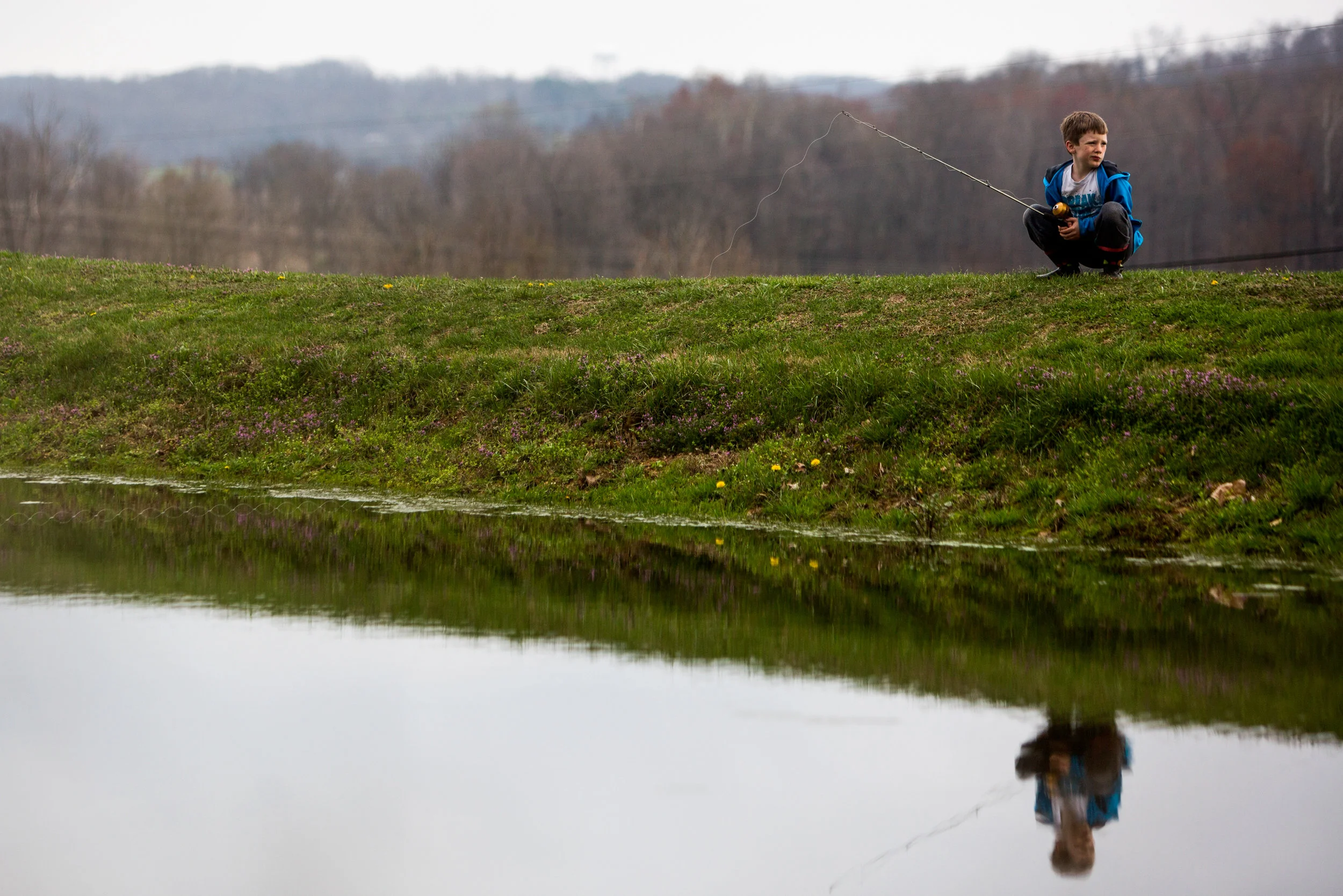 Marshall Schepers of Dubois, 8, waited for a bite while fishing at his grandmother's pond in Dubois on Tuesday during his spring break.