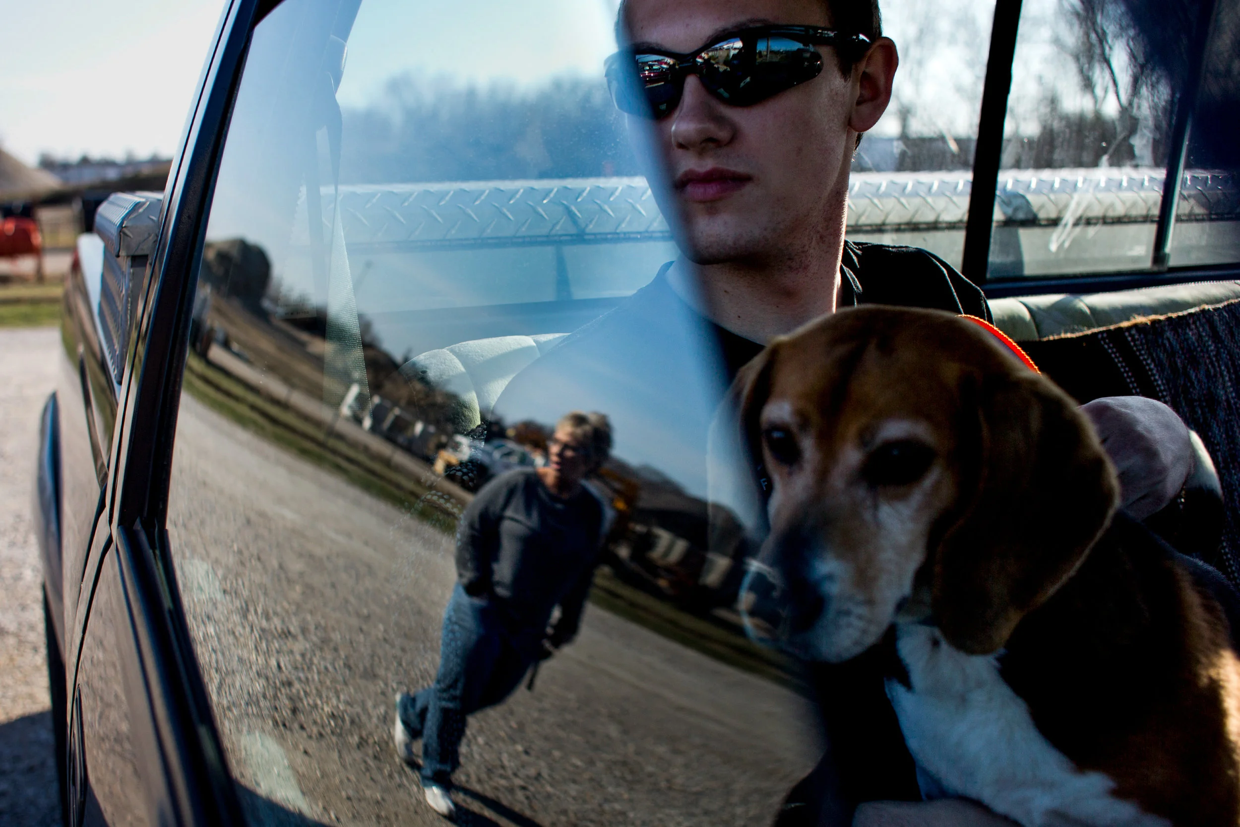 Zach Buechlein of Jasper, 17, watched his mother, Sheila, walk over as he sat with Clive for a moment before returning him to the shelter during the Dubois County Humane Society's Dog Day Out on Sunday afternoon in Jasper. The Dubois County Humane Society allows people to come to the shelter and check out a dog between 4:30-6:30 p.m. on Sundays.