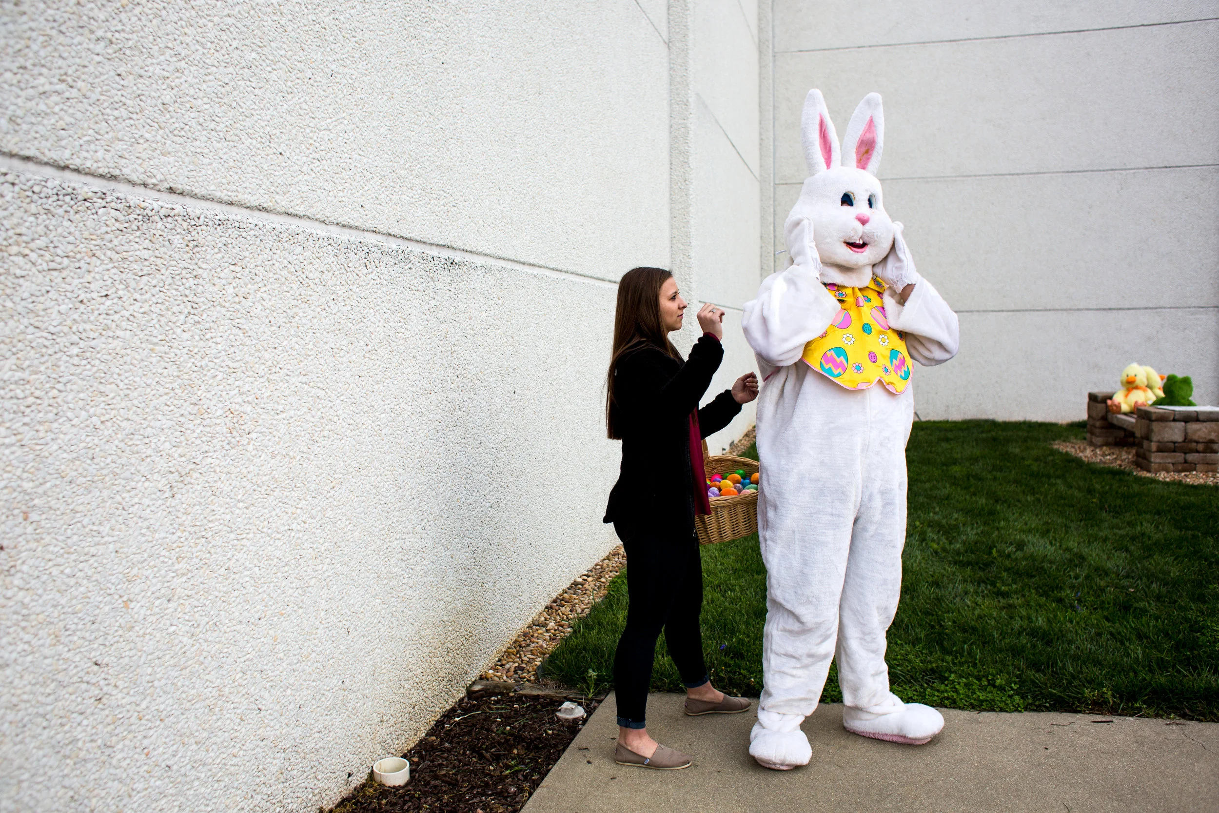 Kendyl Heeke, 15, helped Jackson Brosmer, 16, both of Celestine, adjust his bunny costume before the Easter egg hunt on Sunday at St. Celestine Catholic Church. The sophomore class from both St. Isidore Parish campuses volunteered to hide Easter eggs and dress up as the Easter bunny to serve the children of the congregation after the 8 a.m. Mass.