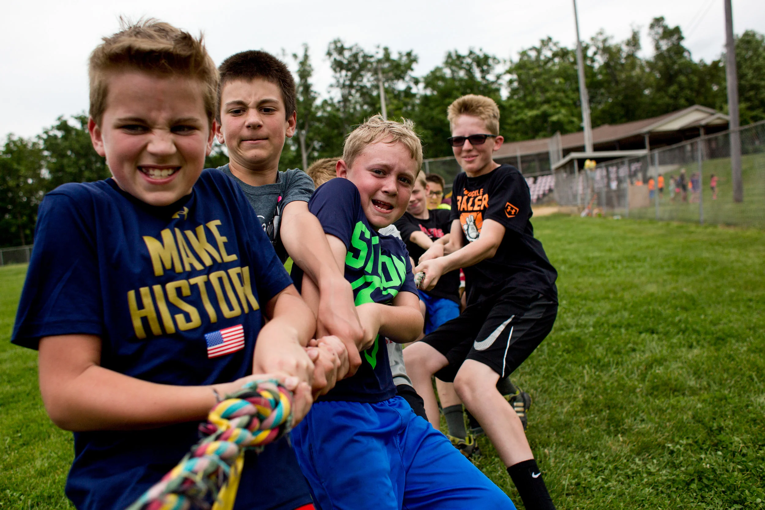 Holland Elementary School fifth-grade boys Jared Voegerl, from left, Kamren Neukam, Beau Schmitt and Keaton Allen competed in tug of war against the fifth-grade girls during the school’s field day Wednesday at Holland Park. Different grades organized into teams to compete in various activities from tug of war to three-legged races.