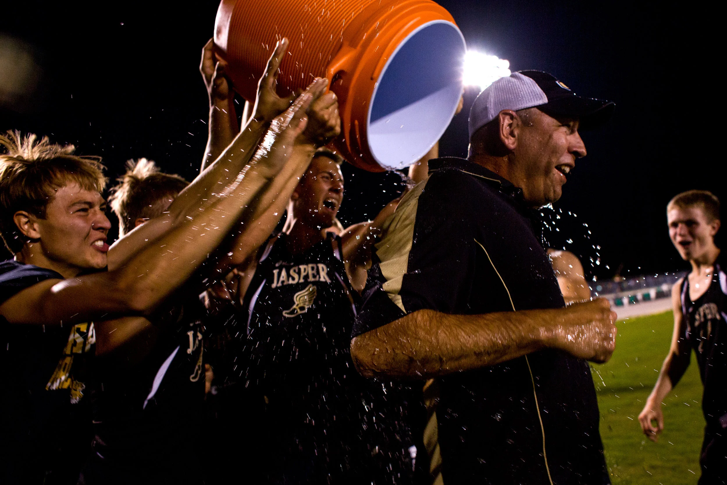 Jasper boys track members dumped water on Coach Kevin Schipp after being announced the boys track sectional champions at Perry Central High School in Leopold. 