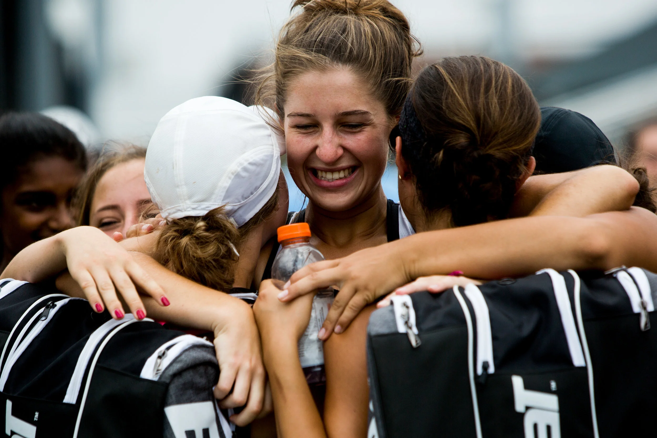 Jasper's Mallory Ahlbrand hugged teammates Jillian Seger, right, and Kathleen Messmer after they won their No. 2 doubles match during the semistate tennis match on Saturday in Jasper. The Wildcats dumped Evansville Memorial 4-1 for a semistate title - it's third straight state finals berth for the Wildcats.